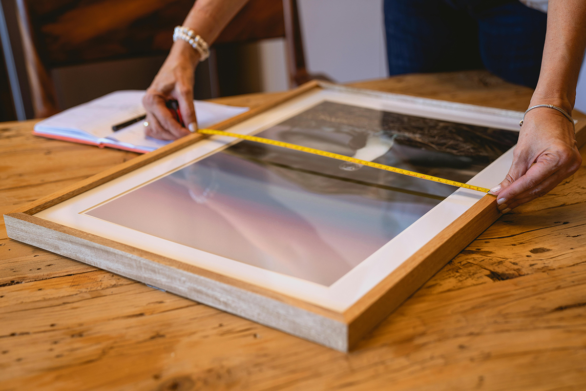 Artwork measurement and framing process as part of a bespoke art curation and collector concierge service.