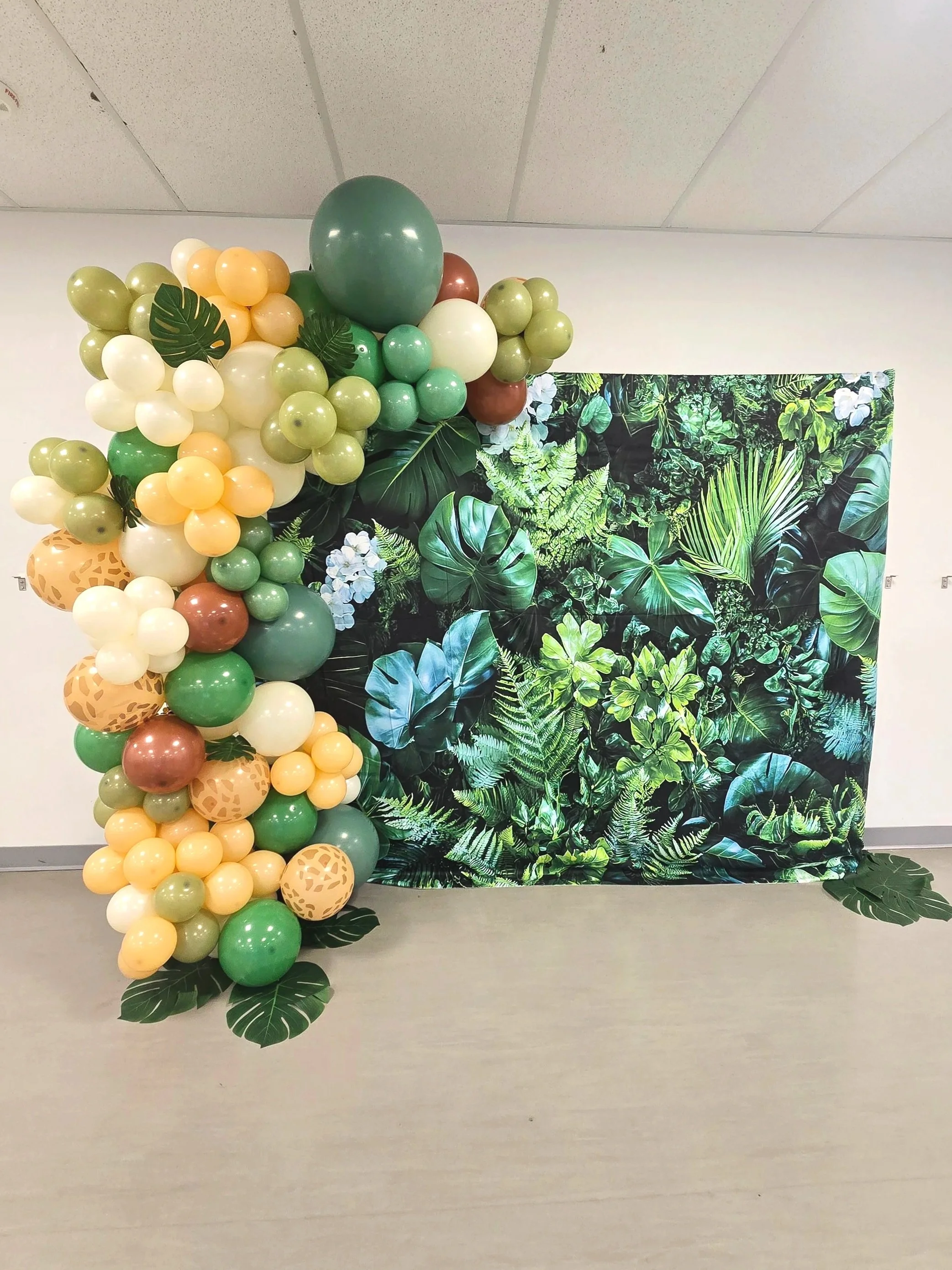 Safari themed backdrop with balloons