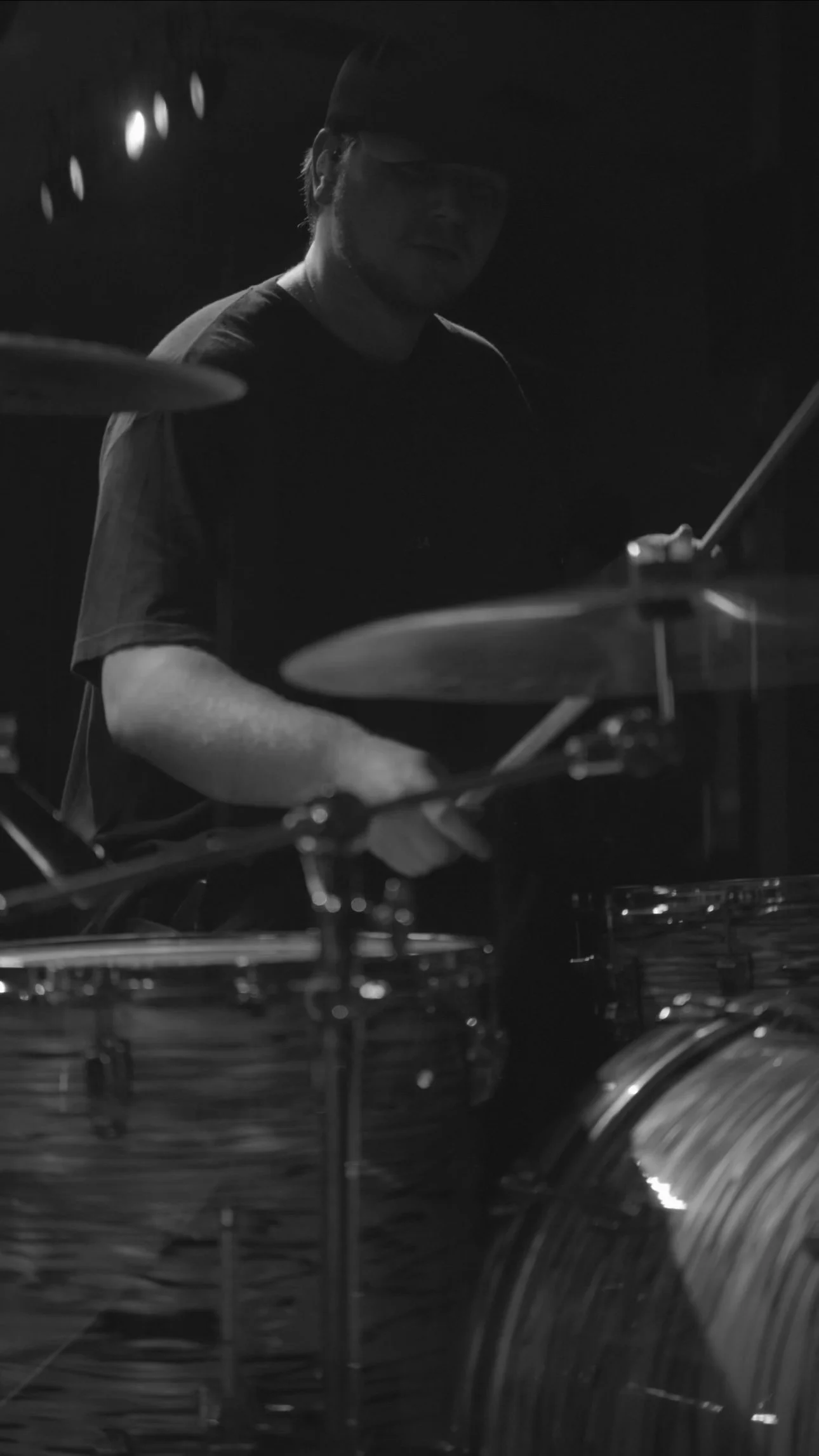 Nashville drummer Collin Dobbs wearing Bellos Audio in-ear monitors during a live performance.