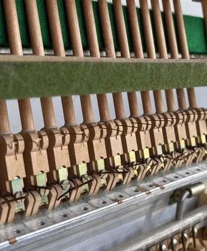 Piano tuner near Baulkham Hills repairing upright piano