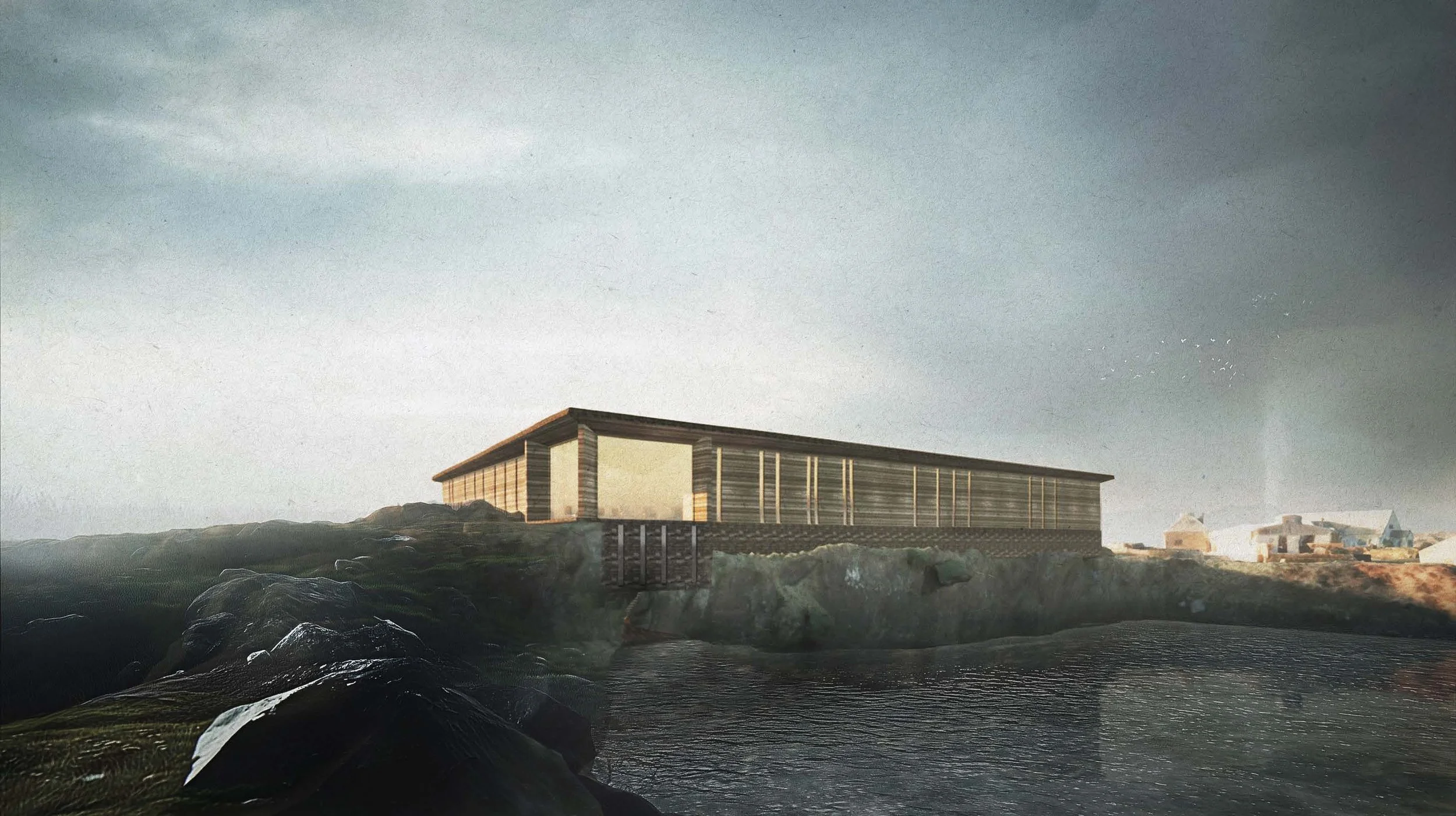 A modern building with a flat roof and vertical wooden slats on the exterior, situated on a rocky hillside near water under a cloudy sky.