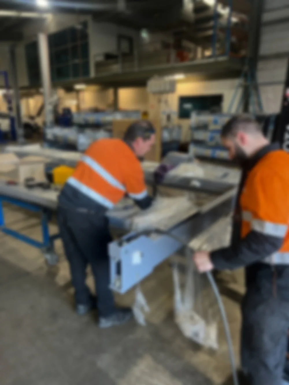 two men working on an equipment