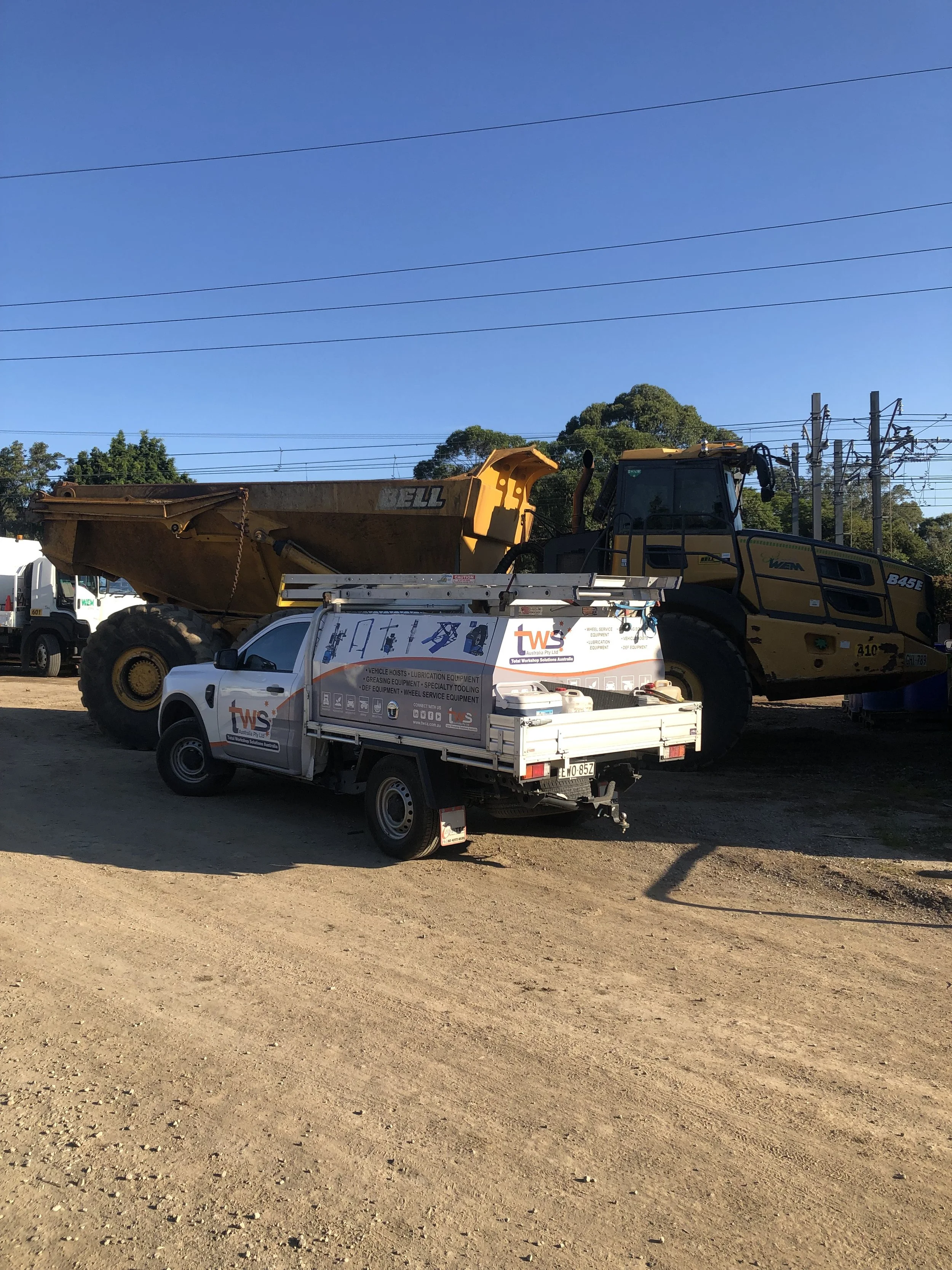 TWSA service vehicle on-site installing automatic grease lubrication system on heavy construction equipment in NSW