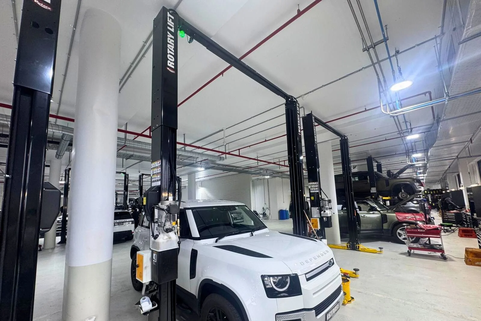 Rotary two post vehicle hoist installation in a high-volume automotive service centre in Artarmon NSW.
