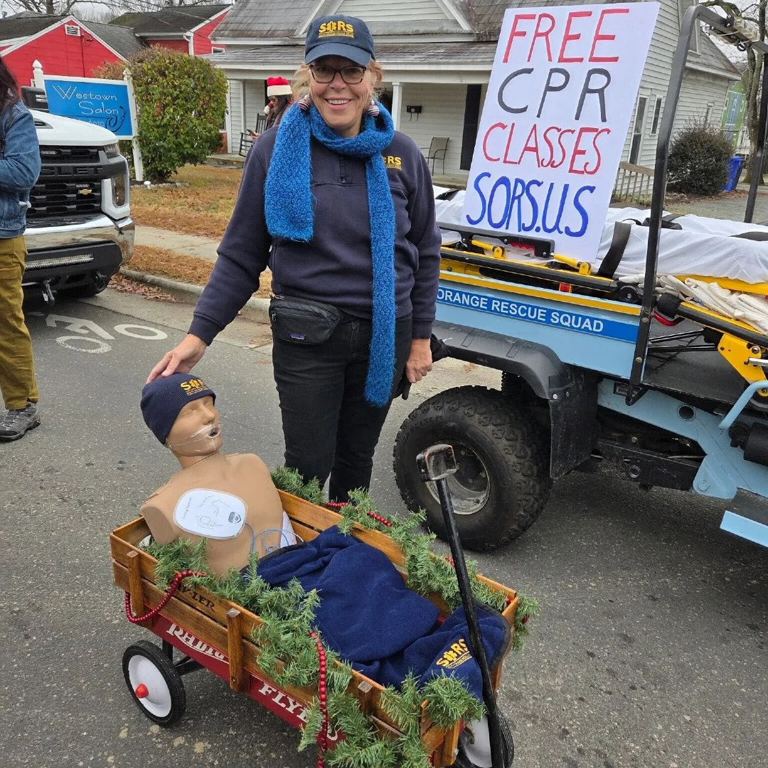 Here's Carol Watson and one of our manikins getting festive ahead of the Carrboro-Chapel Hill Holiday Parade last weekend. Find a free community CPR class or request a private training for your workplace or friend group at sors.us/cpr. Here's to a sa