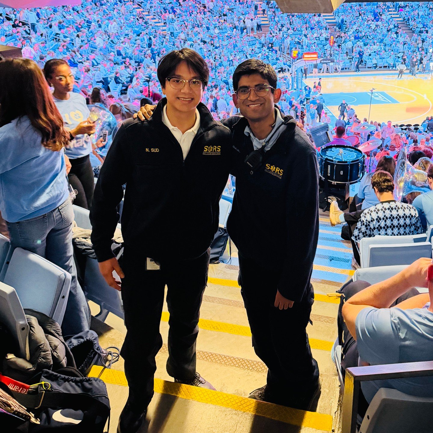 Aarav Mehta and Neil Sud at the epic UNC vs Duke nail-biter! While we&rsquo;ve got volunteers from every local powerhouse, these besties were locked in: &lsquo;watching the good guys win&hellip;&rsquo; 😏🚑🏀&rdquo;