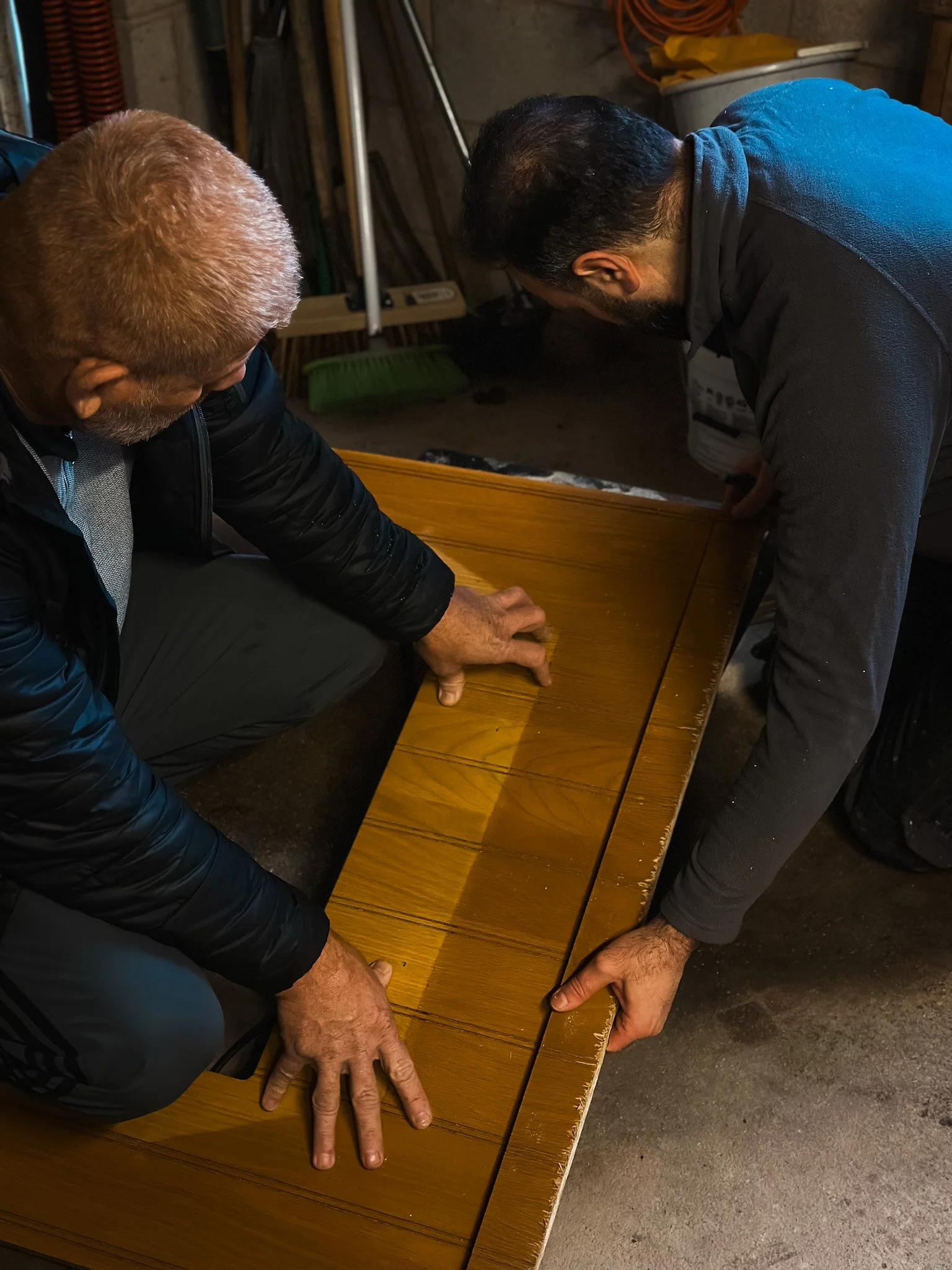 2 handyman cutting wood