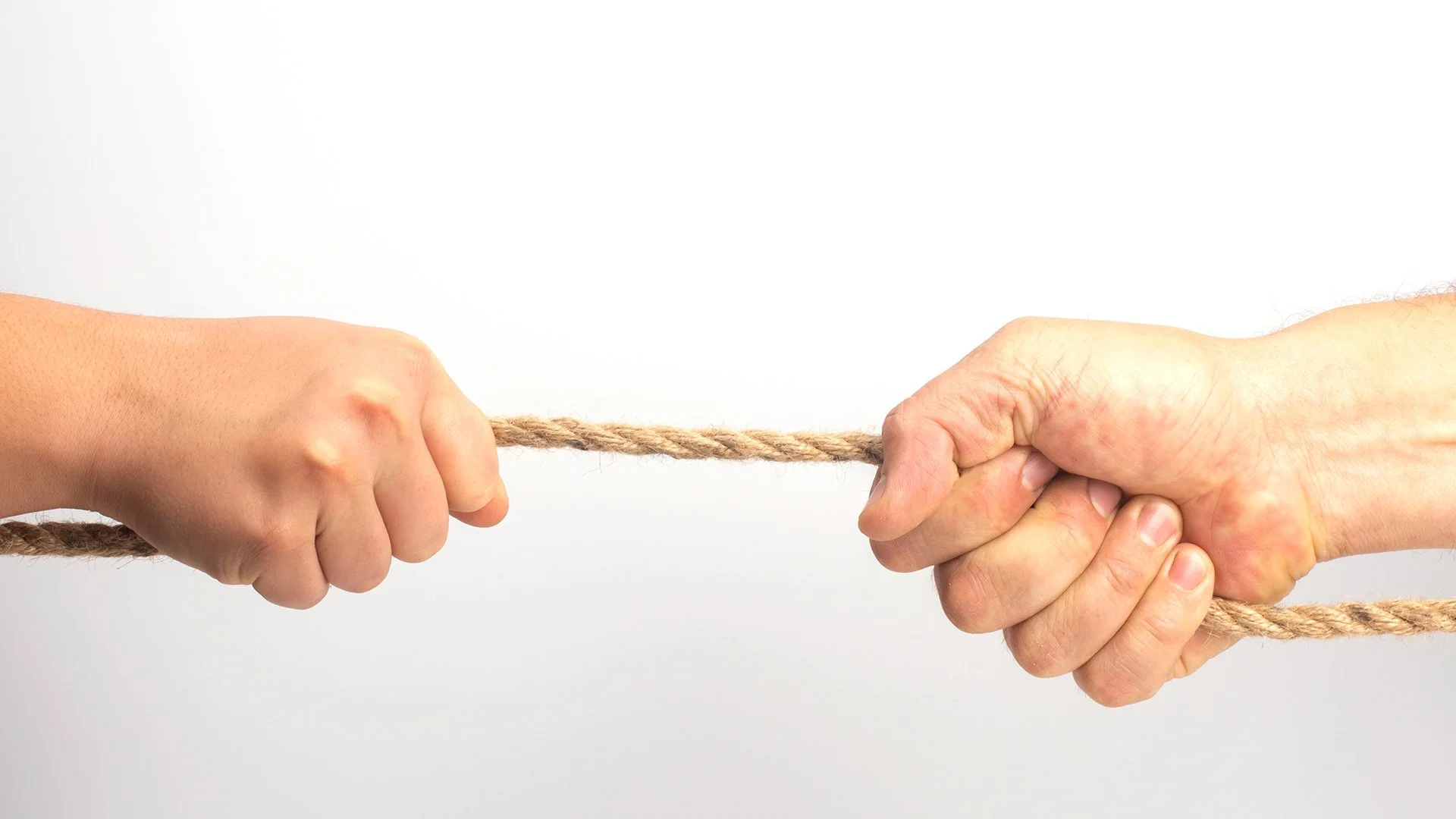 Divorcing mother and her ex pulling on a rope