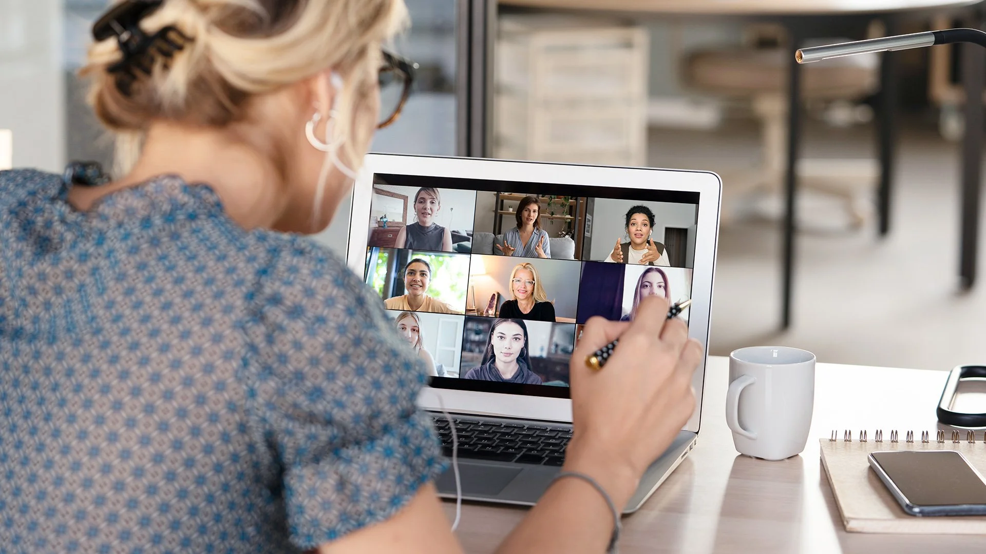 Divorcing mother participating in a virtual group on laptop computer