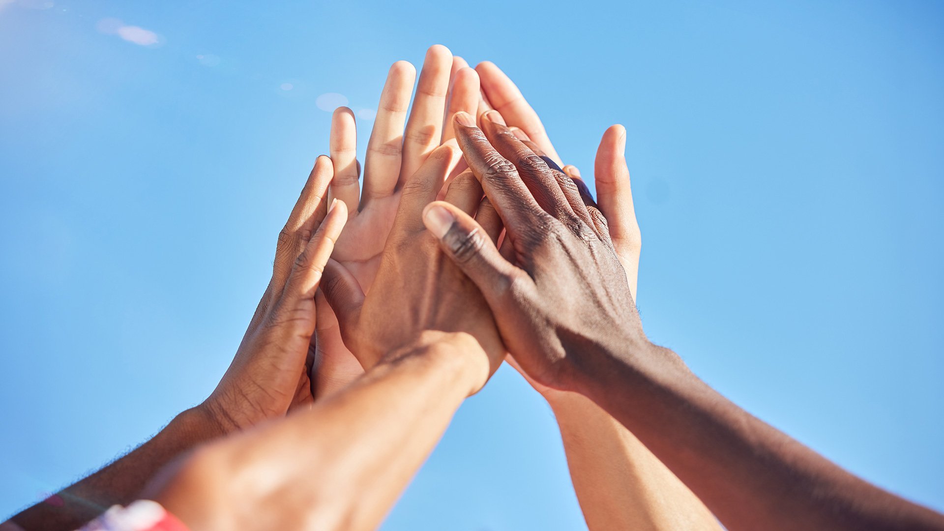 Hands of several divorcing mothers, held together