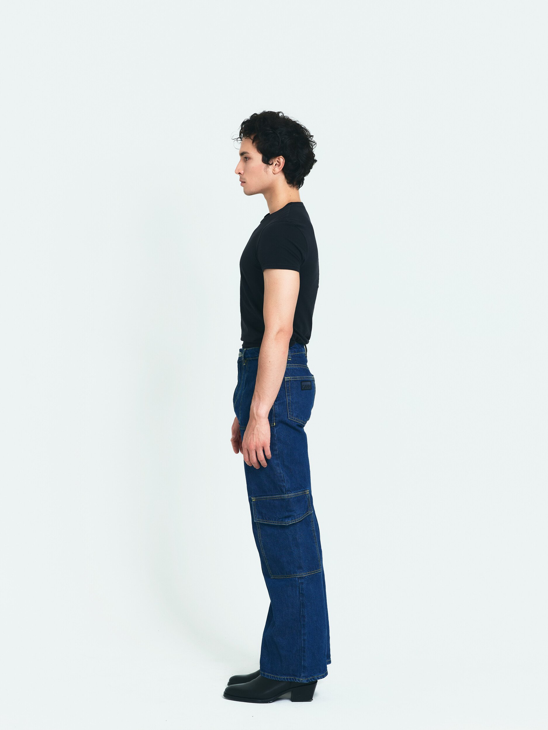 Model digitals: full-length side profile of the male model from the opposite side