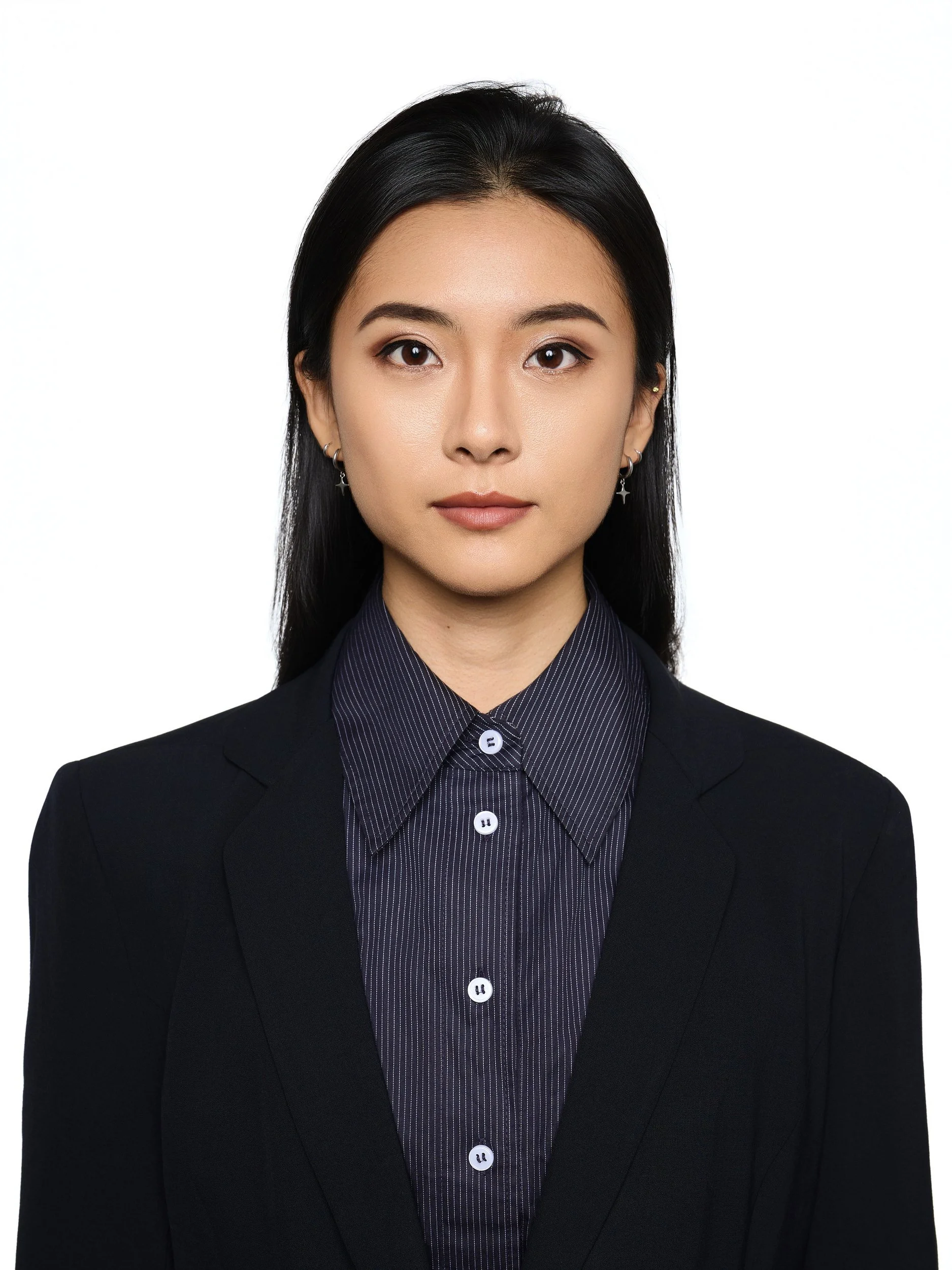 Front-facing ID-style headshot of a woman in a black blazer and pinstripe shirt