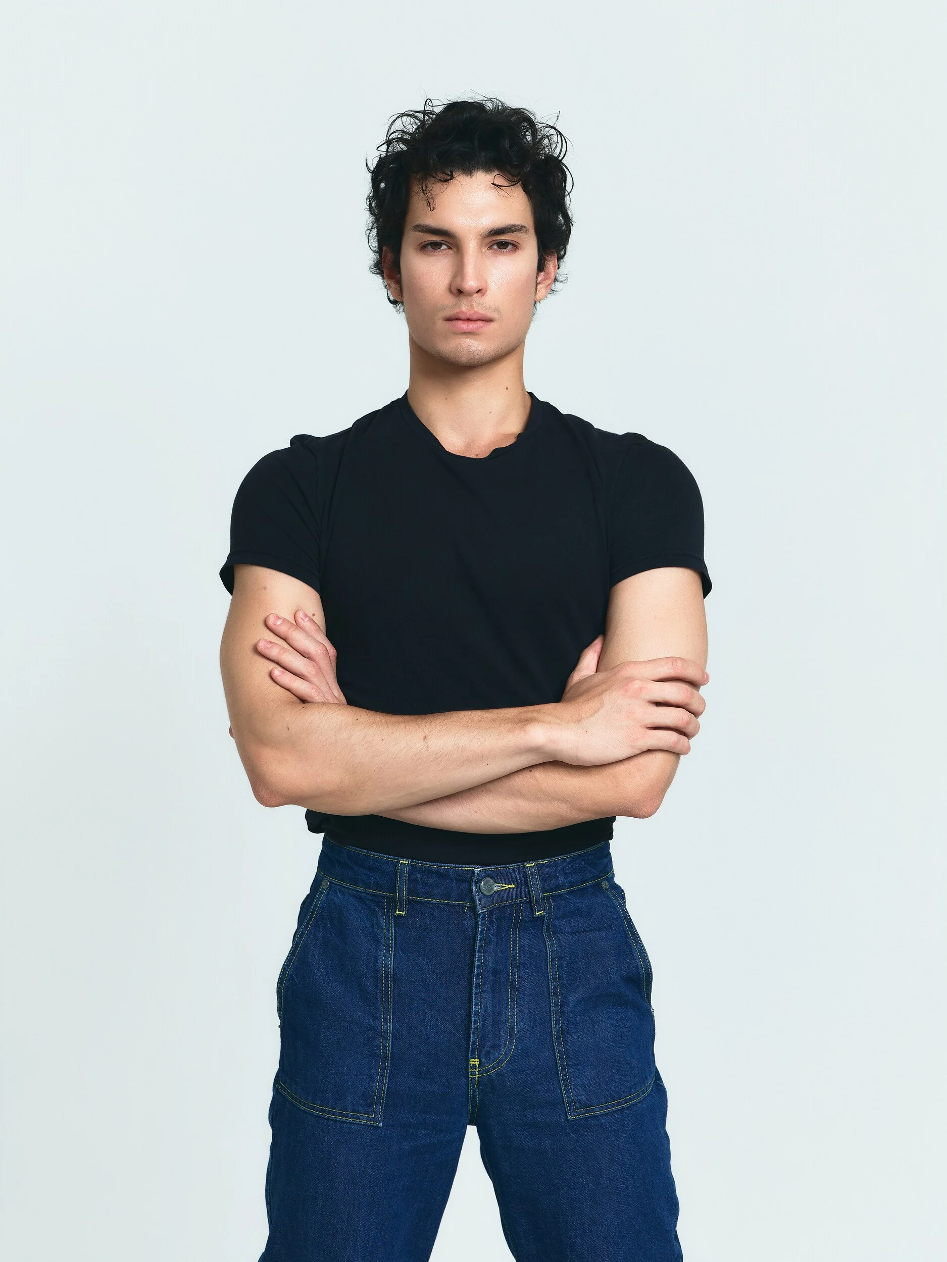 Model digitals: three-quarter shot of the model with arms crossed