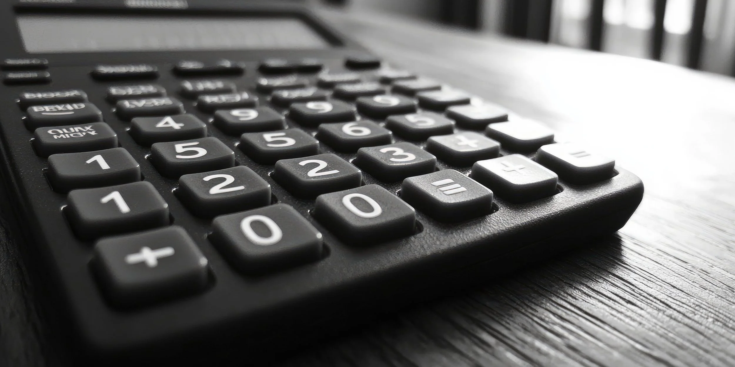 Black and white photo of a calculator