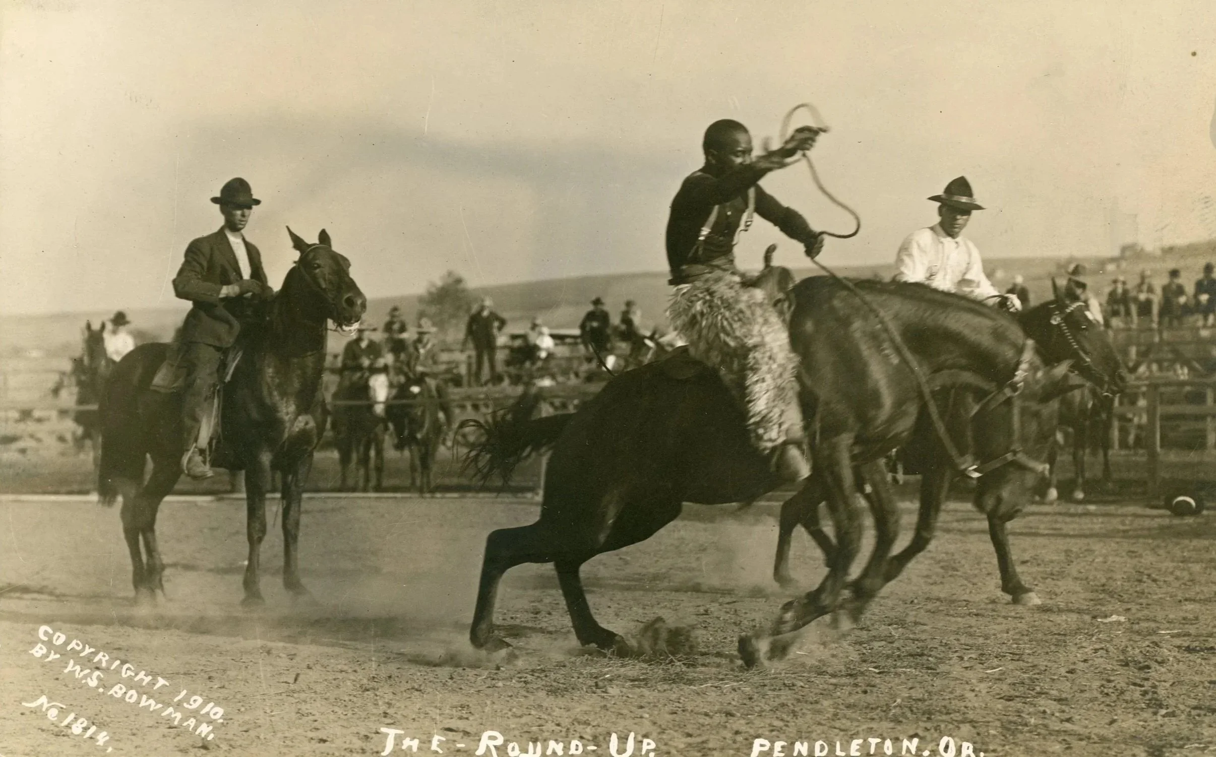 ★ c. 1910, Jesse Stahl (center) performing in the first annual "Pendleton Round-Up," Pendleton, Oregon. African American real photo postcard collection, Johns Hopkins Libraries, Digital Collections. Image ID MS.0583. 