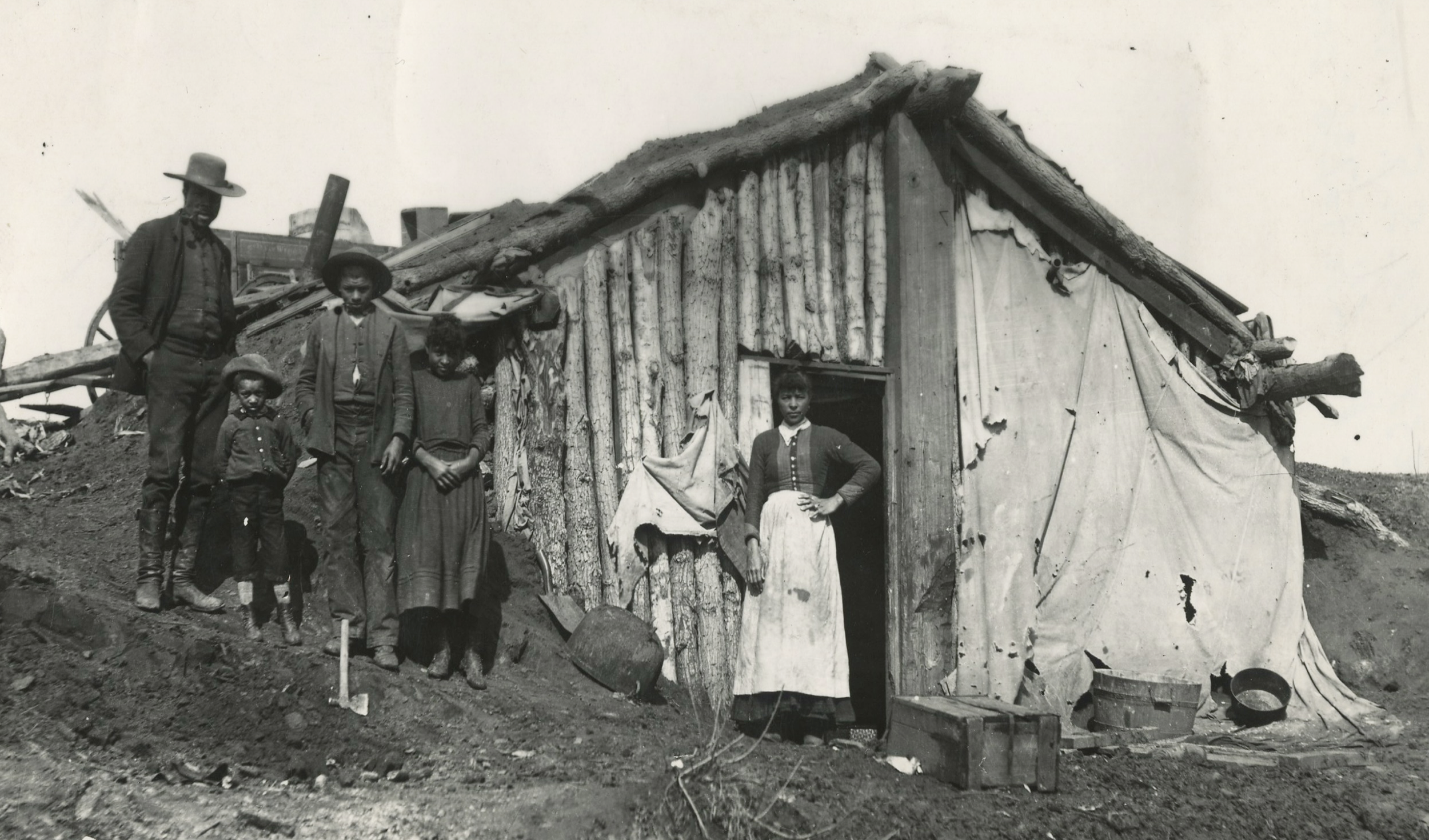 ★ c. 1889, Black family stands in front of their dugout home, Oklahoma Territory. Oklahoma Historical Society Photograph Collection, OHS (4574.17), Oklahoma Historical Society. *In Oklahoma, wood supplies were limited, and many pioneering families re