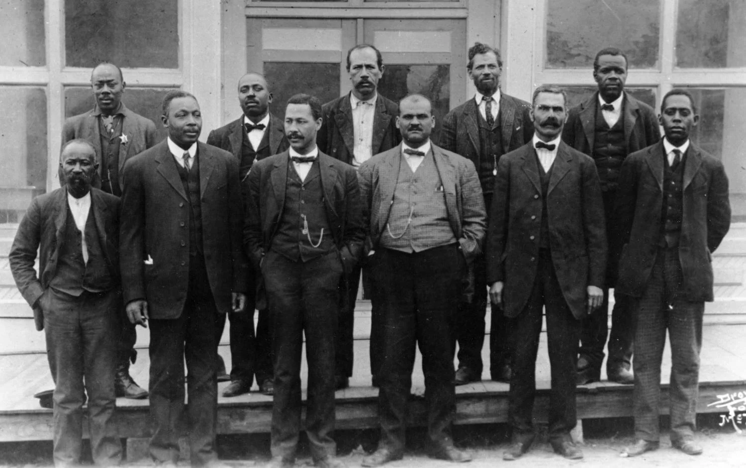 ★ c. early 1900s, Photograph of members of the town council in Boley, Oklahoma. Front row, left to right are William H. Wallace, T.B. Armstrong, D.J. Turner, Thomas M. Haynes, H.C. Cavil, M.J. Jones. Back row left to right are Wash Williams, Dr. Calv