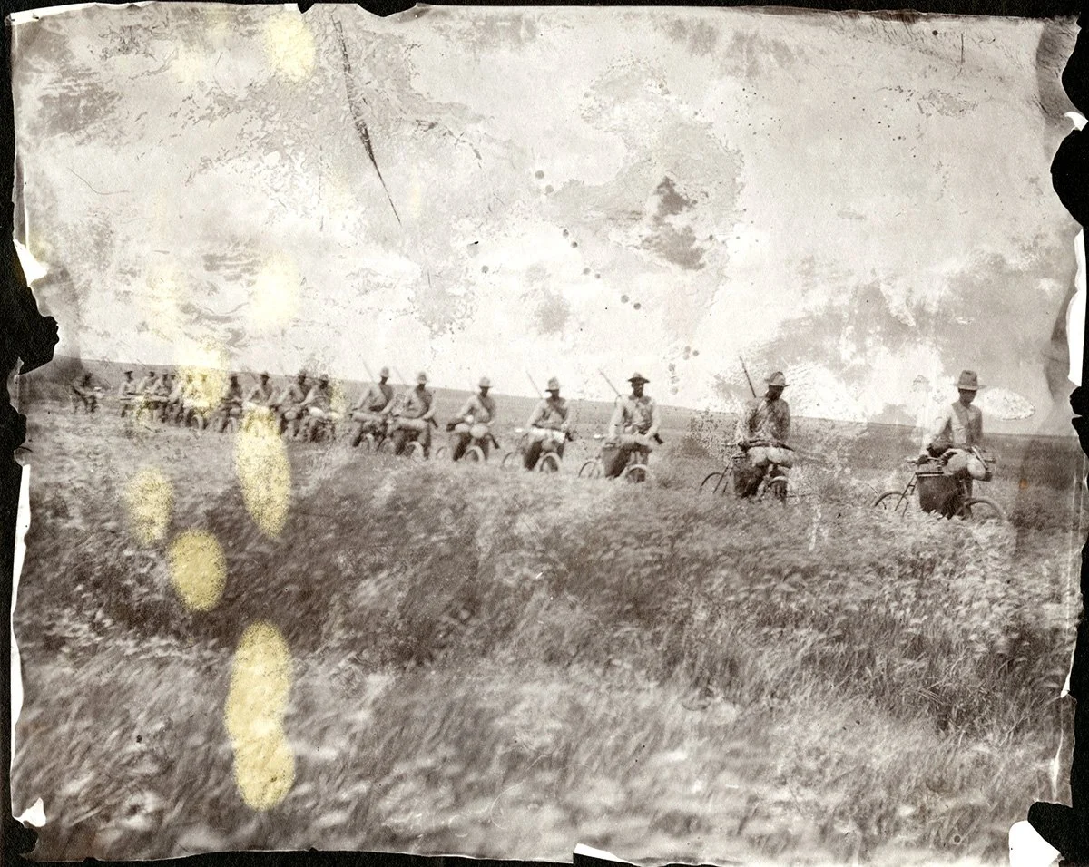1897, 25th Infantry Bicycle Corps walking with their bikes in formation. University of Montana Mansfield Library [672.238]