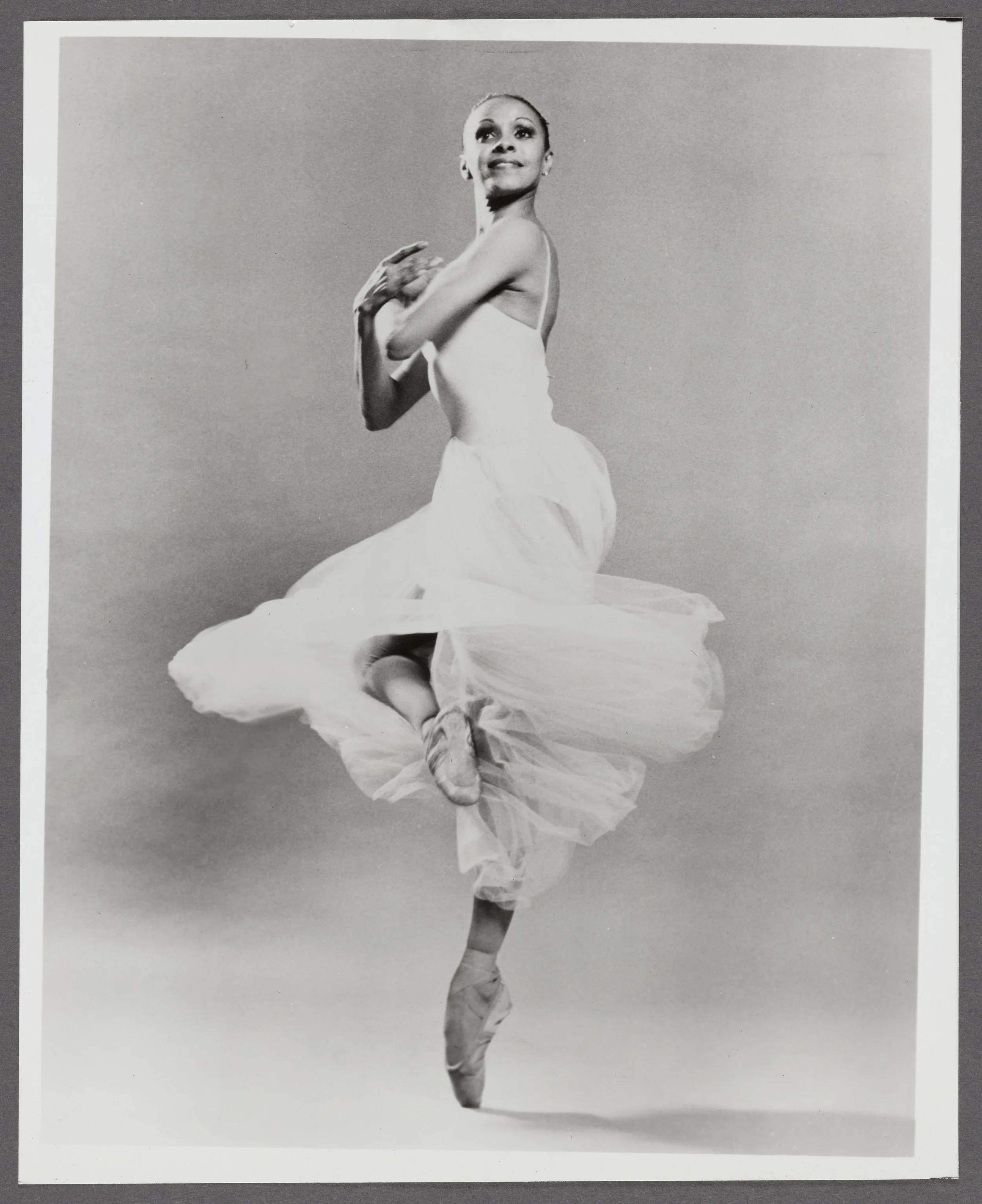 Elena Carter, performing the piece “Serenade,” choreographed by George Balanchine. 

By Martha Swope, courtesy of the Schomburg Center for Research in Black Culture
Dance Photograph Collection
Photographs and Prints Division. Schomburg Center for Res