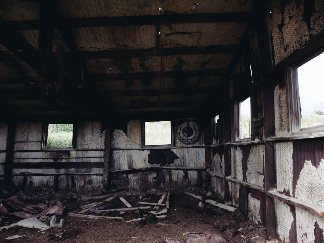 Interior of fire damaged Chicago home showing burned walls