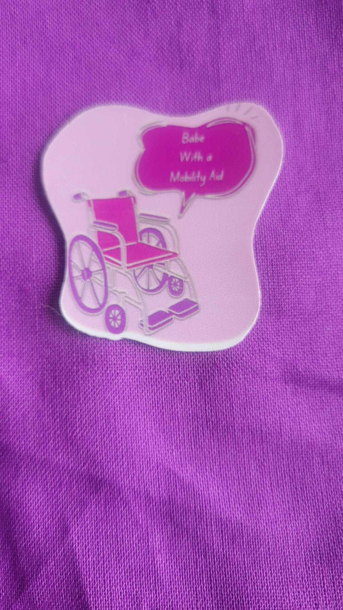 Babe with a mobility aid sticker