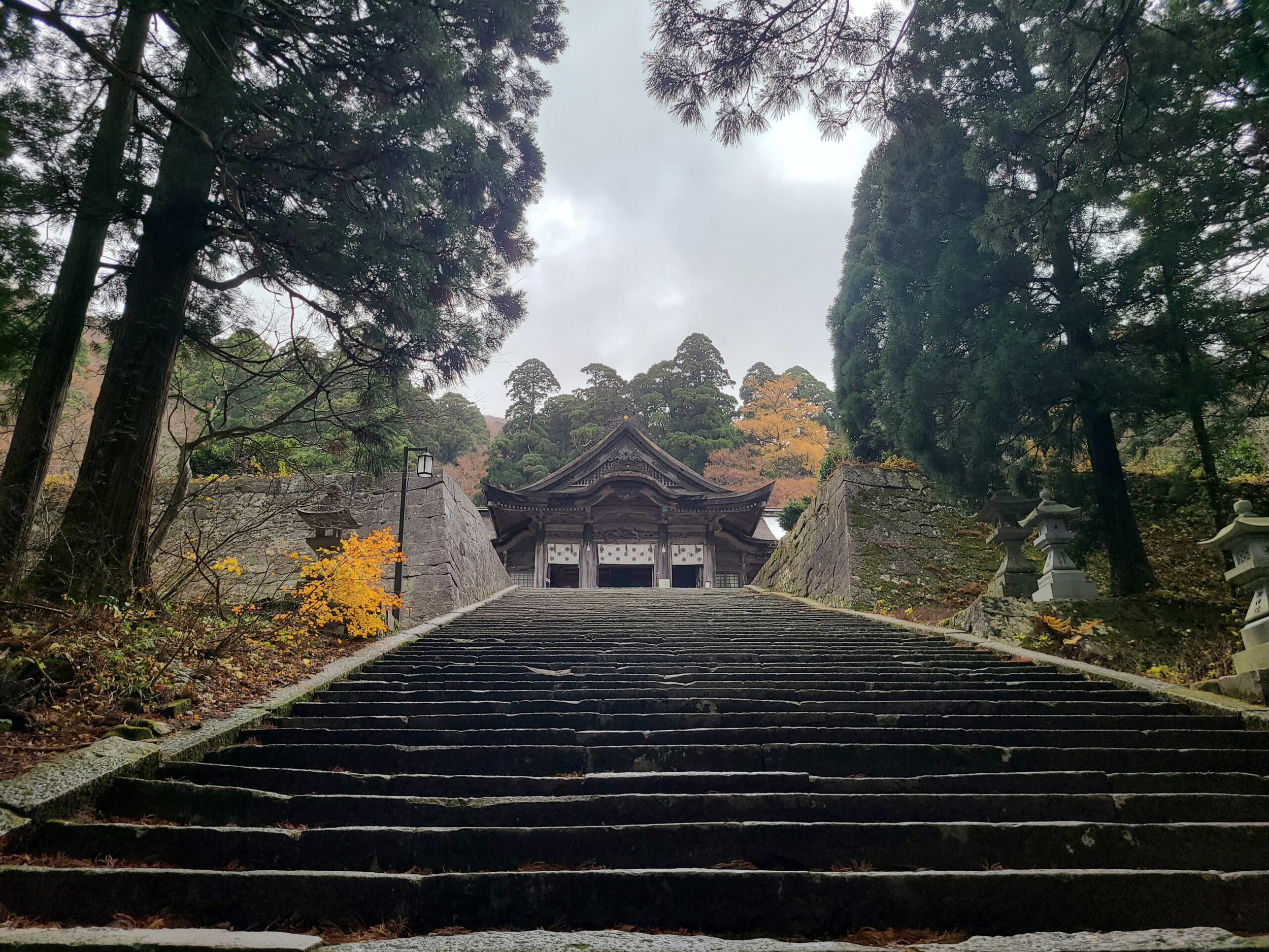 Stone staircase leading up to Oogamiyama Shrine's inner sanctuary on Mt. Daisen — a sacred power spot hidden in the forests of Tottori.