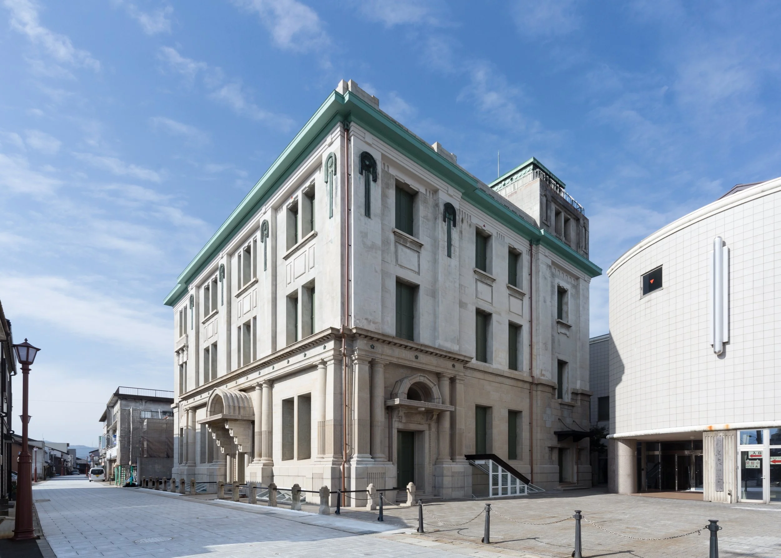 The 1927 former Ōwada Bank building in Tsuruga — a grand Taisho-era stone landmark reborn as a cultural museum.