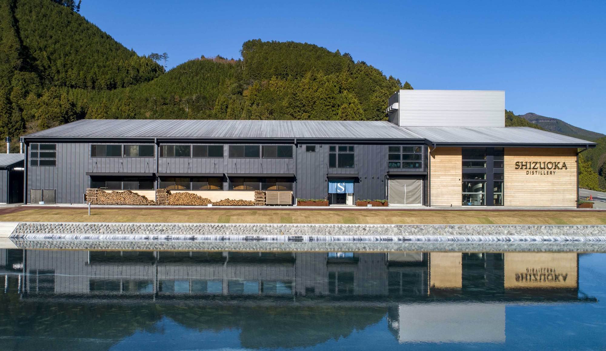 Gaiaflow Shizuoka Distillery reflected in still mountain water — a craft whisky hidden gem nestled in the forests of Okushizu.