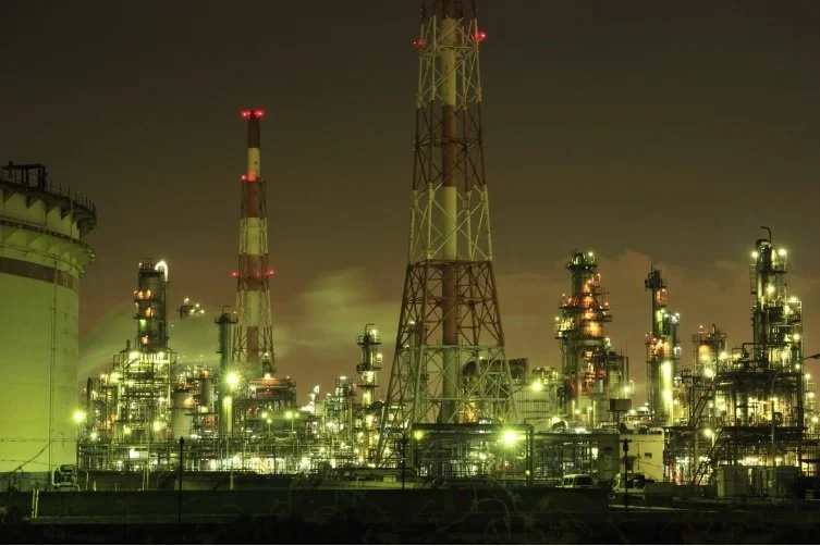 Sakai's coastal industrial zone glowing at night — a surreal space-station-like factory nightscape in Osaka, Japan.