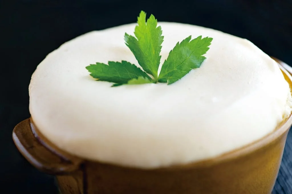 Snow-white Tamago Fuwafuwa in a ceramic ramekin, garnished with mitsuba — an Edo-era delicacy revived in Fukuroi, Shizuoka.
