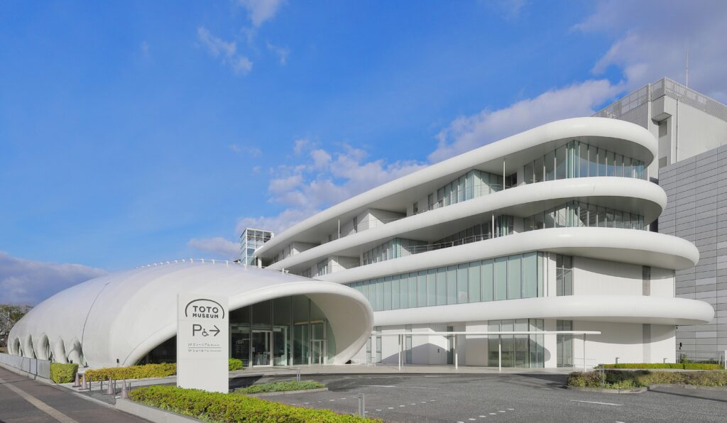 Exterior of the TOTO Museum in Kitakyushu, Fukuoka — an award-winning modern white building showcasing over a century of Japanese bathroom innovation.
