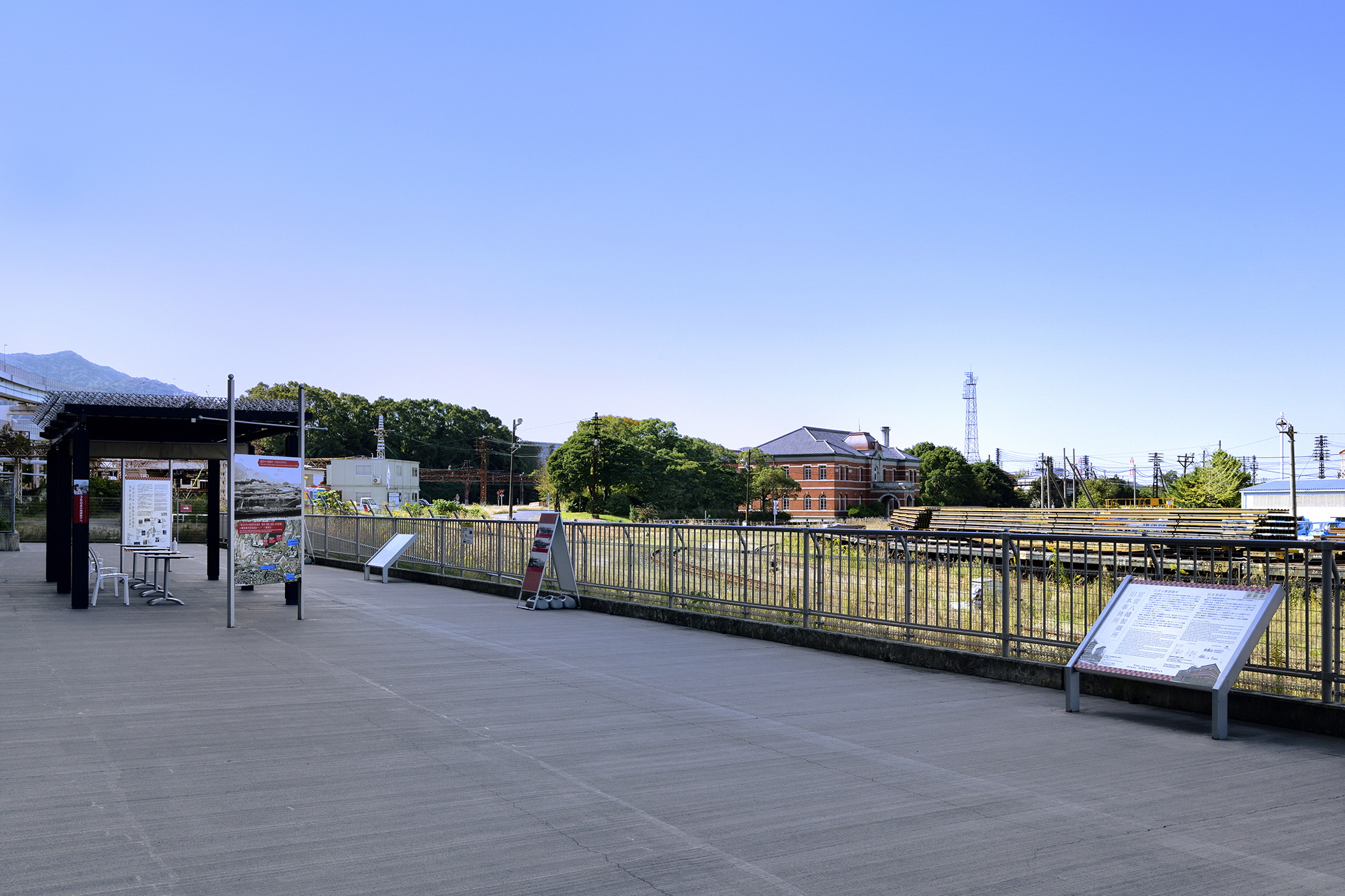 Symmetric red-brick Former Main Office of Yawata Steel Works viewed from the public observation deck — a UNESCO World Heritage site in Kitakyushu.