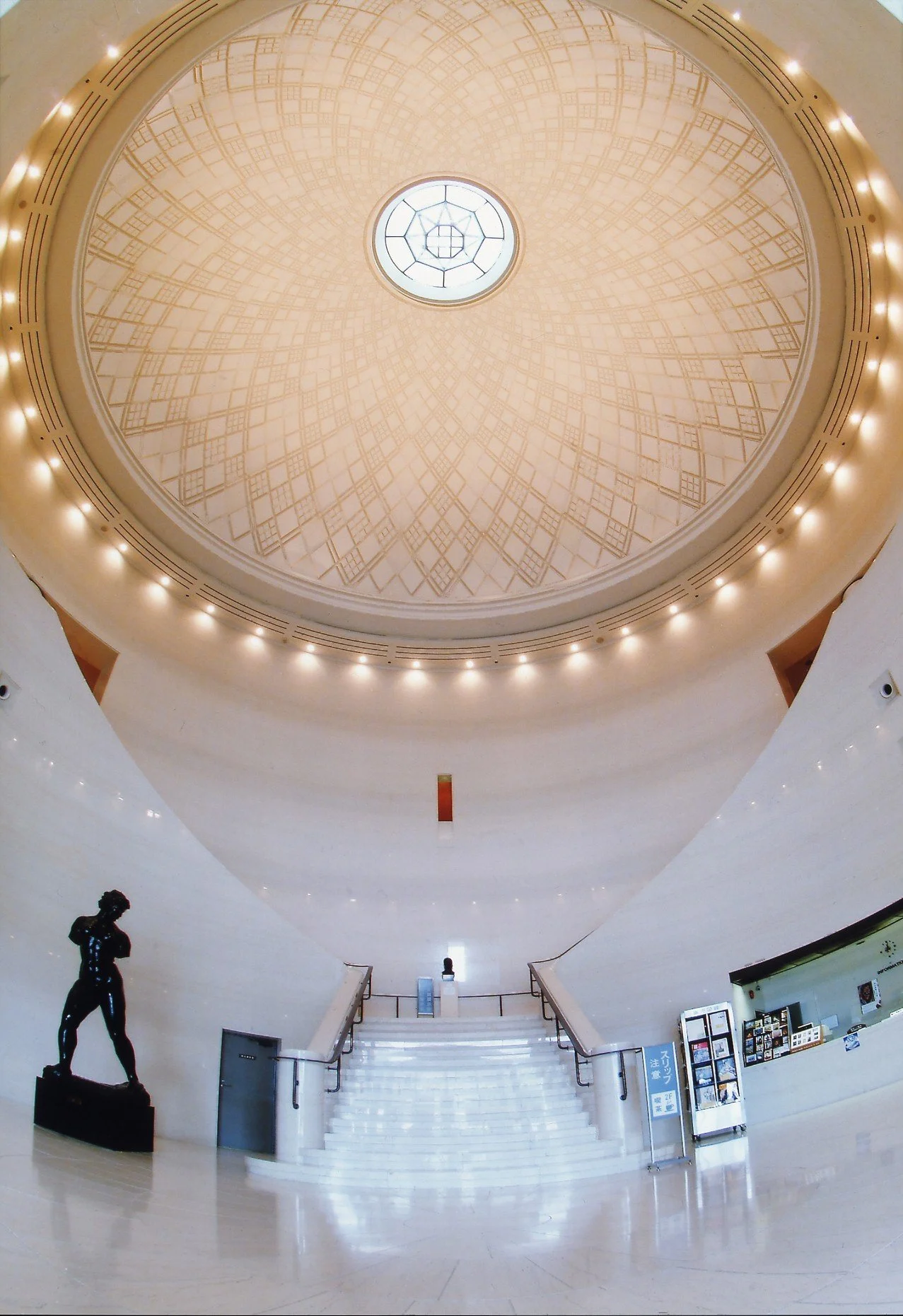 Grand domed entrance hall of Kagoshima City Museum of Art, its geometric ceiling inspired by Satsuma Kiriko cut glass patterns.
