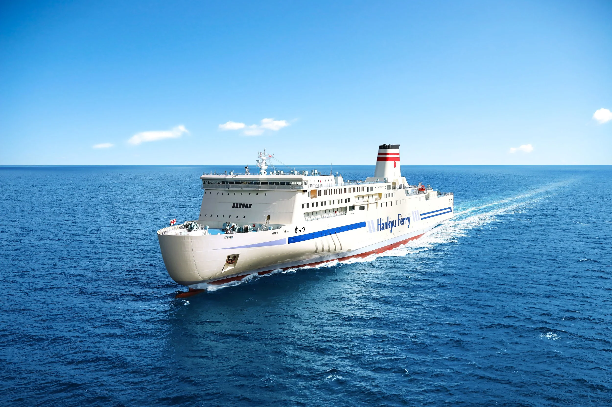 Hankyu Ferry sailing across calm blue seas under a clear sky on its overnight Kansai–Kyushu route — a slow-travel cultural journey through Japan.