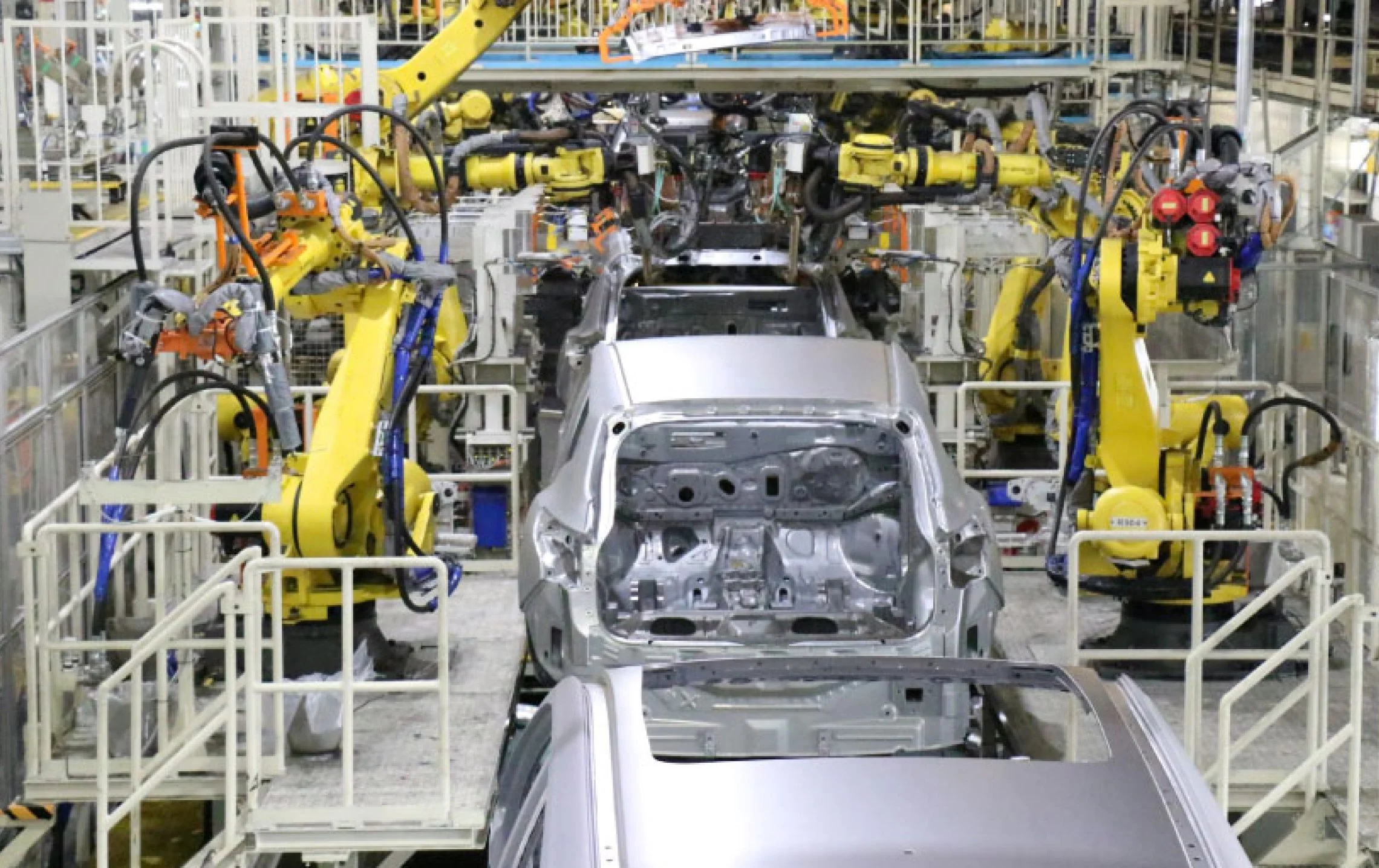 Inside Nissan Motor Kyushu's manufacturing plant in Fukuoka — Japan's largest Nissan facility producing Serena, X-Trail, and Rogue since 1975.