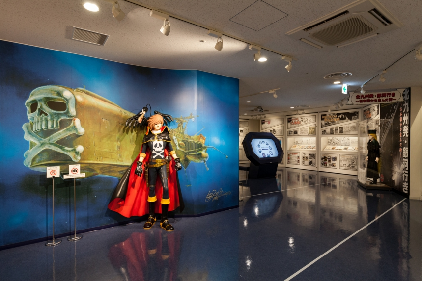 Exhibition space at the Kitakyushu Manga Museum in Kokura, featuring displays dedicated to Leiji Matsumoto and other manga artists connected to Kitakyushu.