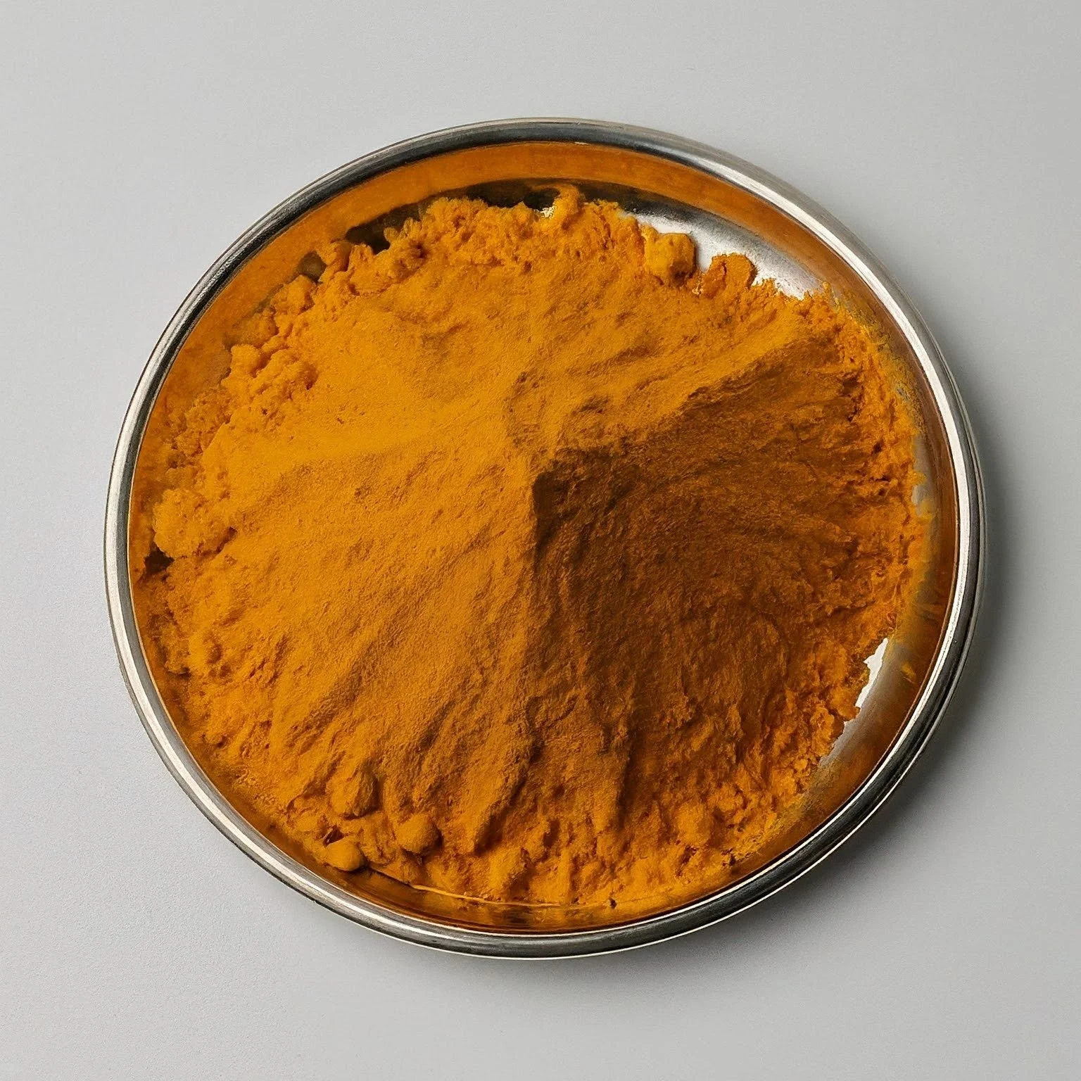 image_fx_photo_of_turmeric_from_india_in_plate_for_exp.jpg