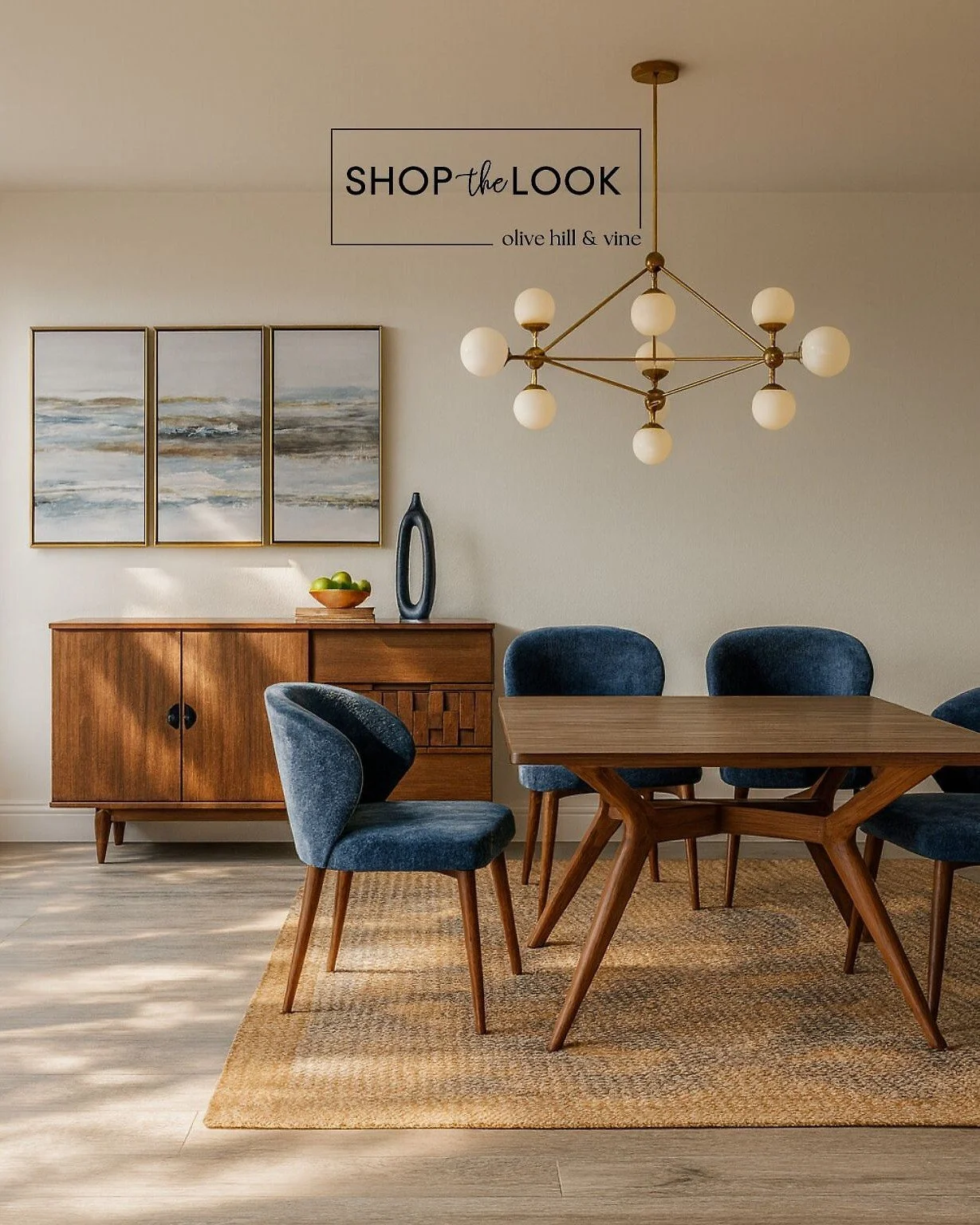 Statement lighting meets mid-century style in this curated dining space. A sculptural chandelier, navy velvet chairs, and geometric details bring warmth, function, and upscale flair&mdash;perfect for entertaining or everyday dining in style. 

Commen