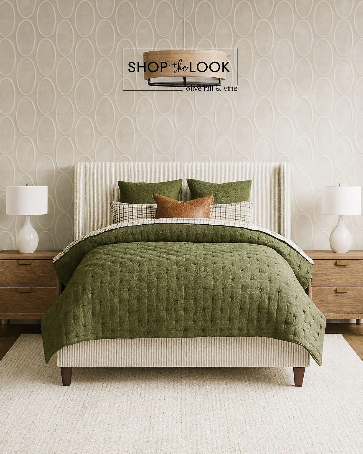 A layered mix of texture and tone&mdash;deep green linen, ribbed corduroy, and soft sand wood create an inviting balance. Mid-century nightstands, a modern wingback bed, and a rustic drum chandelier complete this timeless, nature-inspired bedroom des