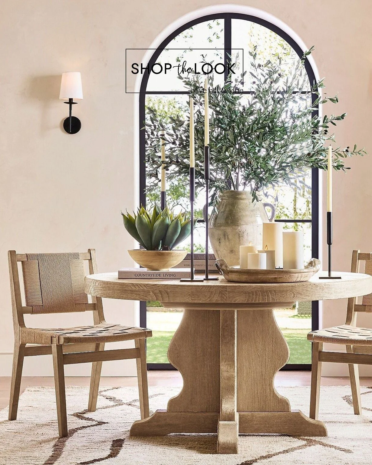 Soft textures and warm neutrals anchor this airy dining moment. A sculpted pedestal table, woven chairs, and simple candlelight make the space feel effortless and inviting&mdash;timeless pieces that bring natural ease to everyday living. 

Comment SH