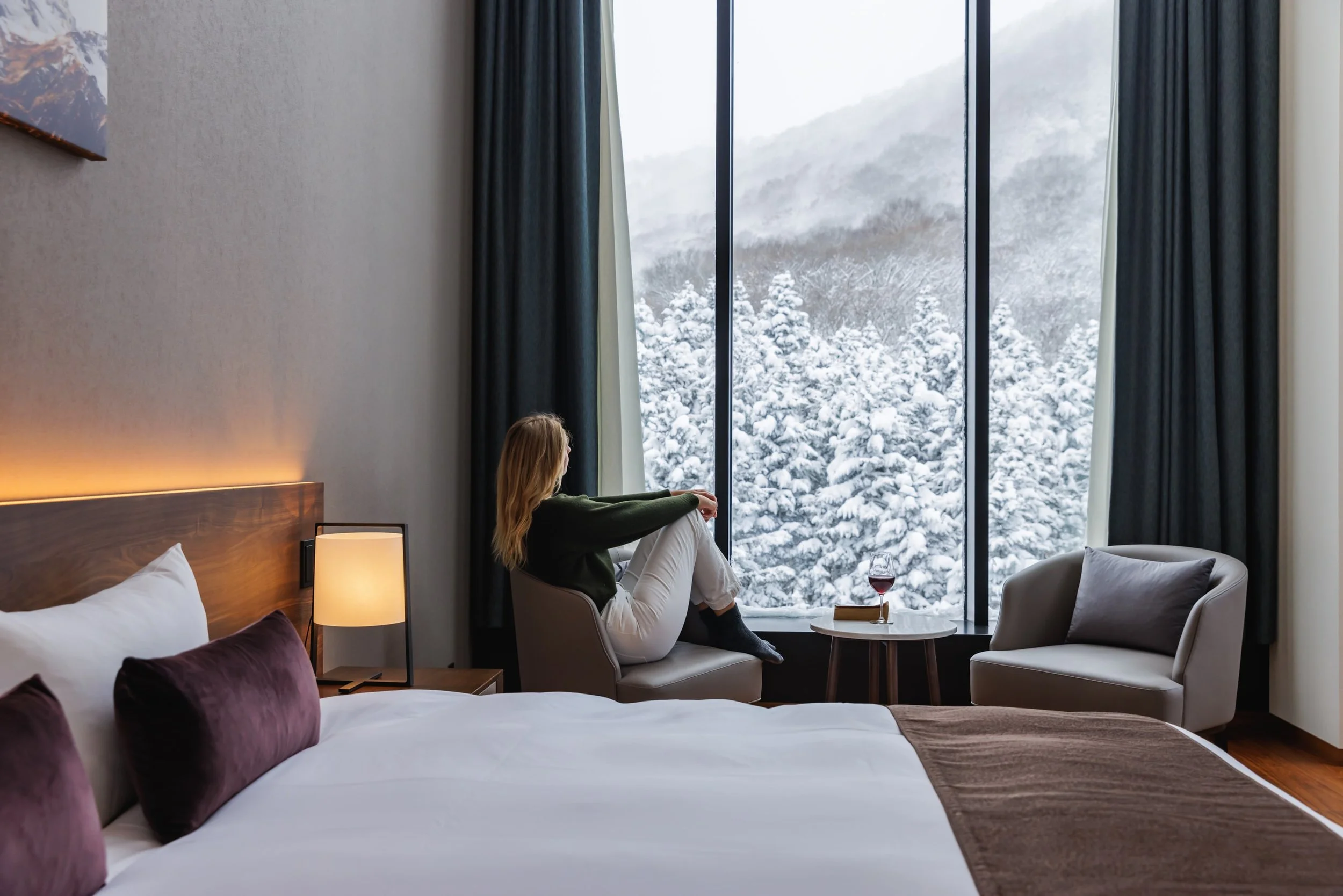 Woman Enjoying Mountain View of Bedroom - The Vale Rusutsu - Rusutsu