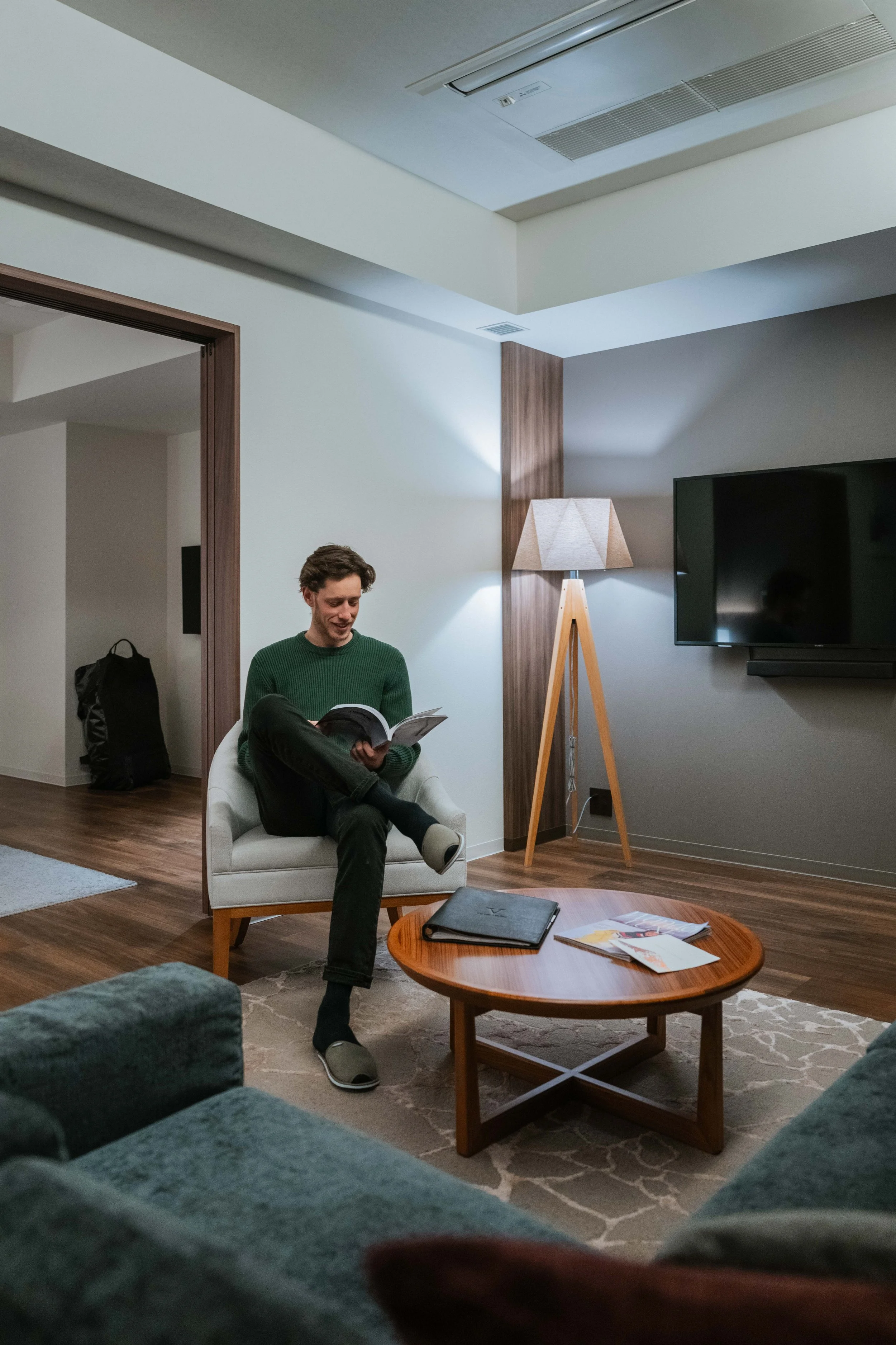 Rami Ben Reading in the Living Room - The Vale Rusutsu - Rusutsu