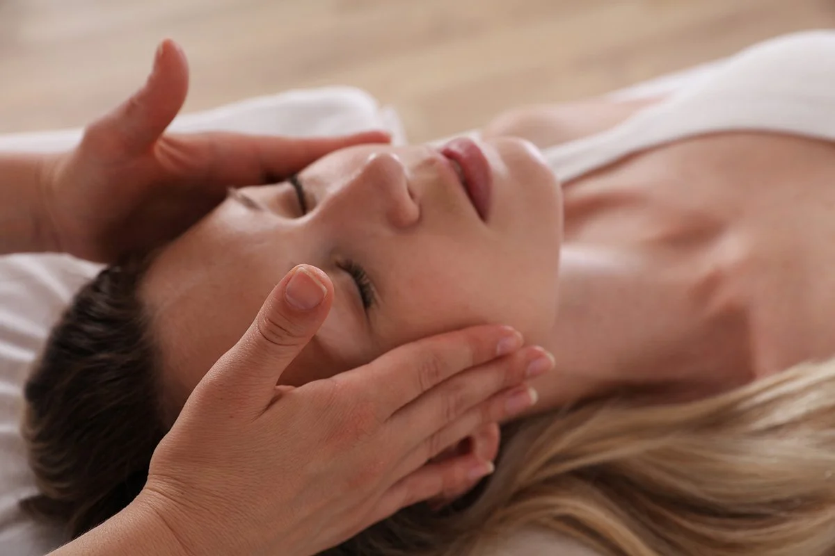 Gentle facial and head massage therapy session