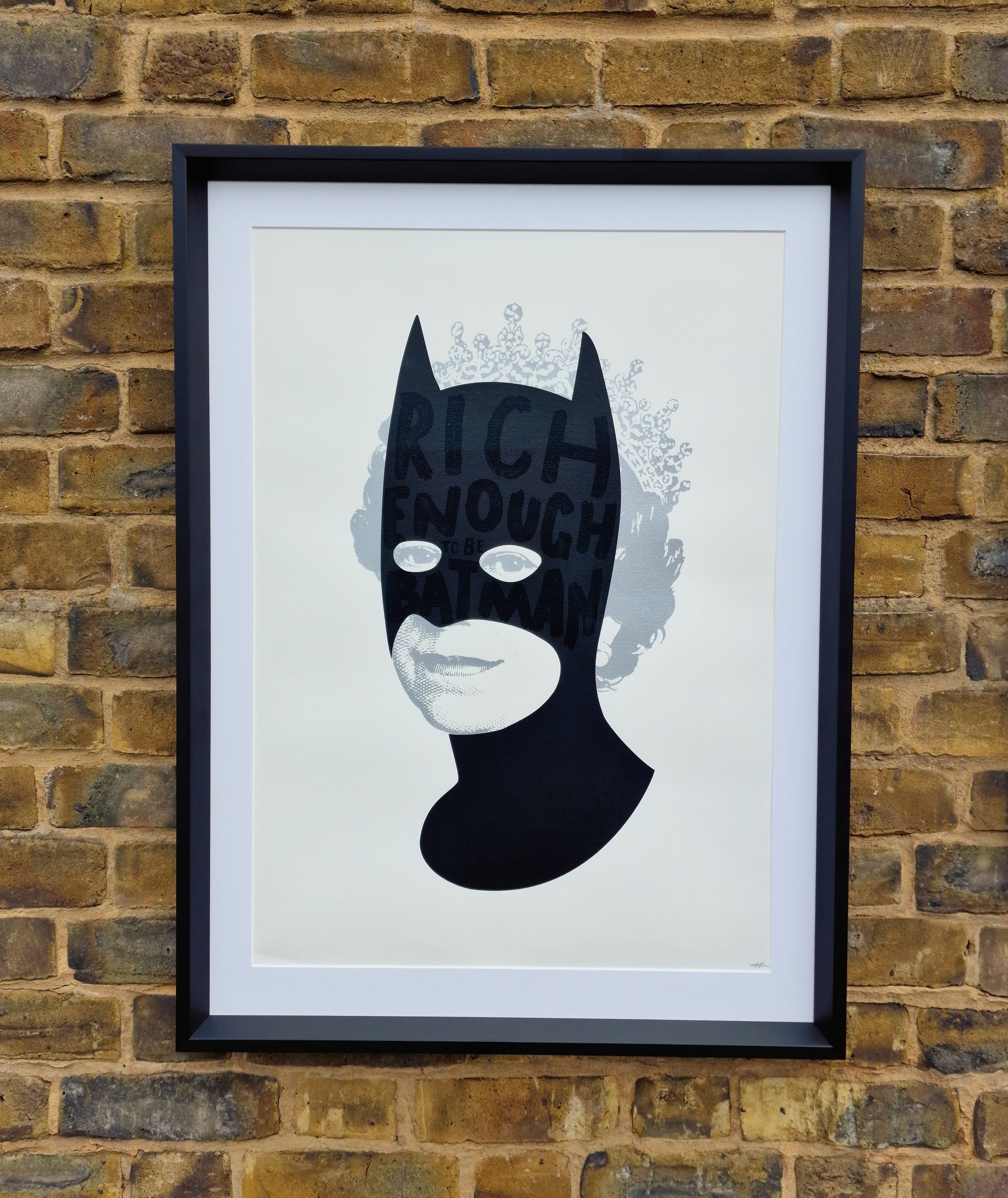 "Rich enough to be batman" in a limited edition print by artist Heath Kane showing the image custom framed by the bespoke framer