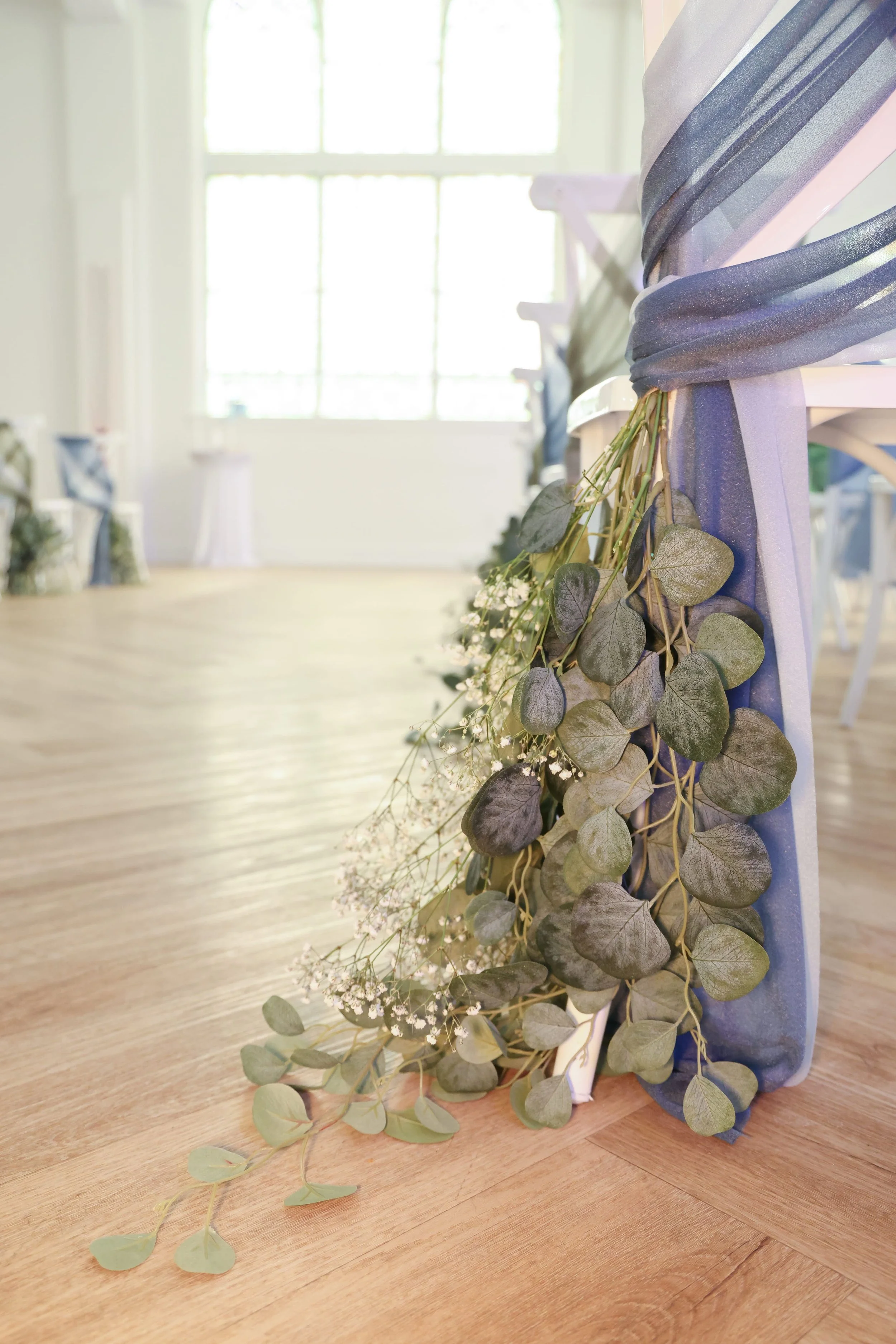 chair-sash-eucalyptus-babys-breath-aisle-detail.jpg