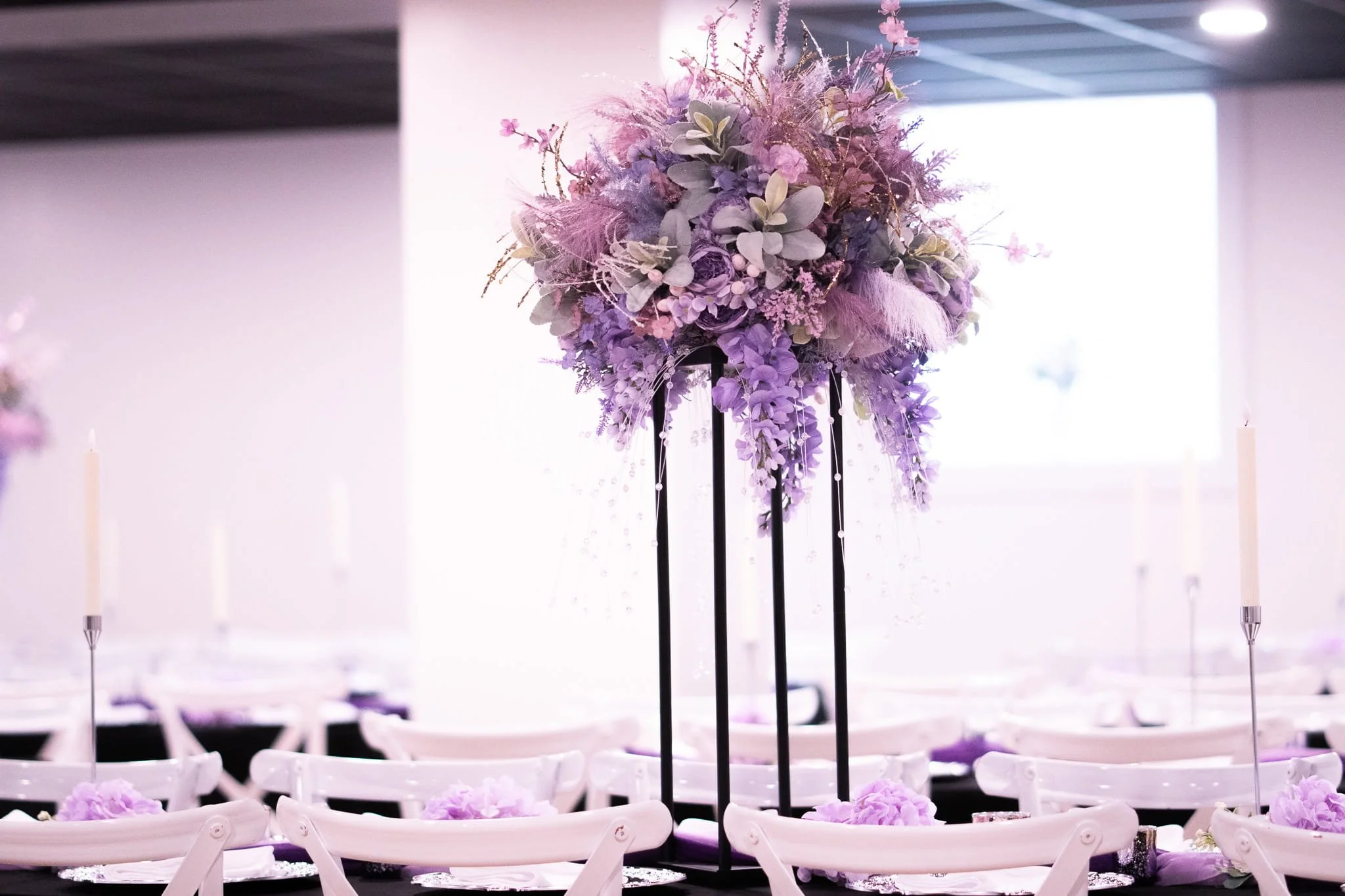 kaleidoscope-weddings-enchanted-tall-centerpiece-candlelit-room.jpg