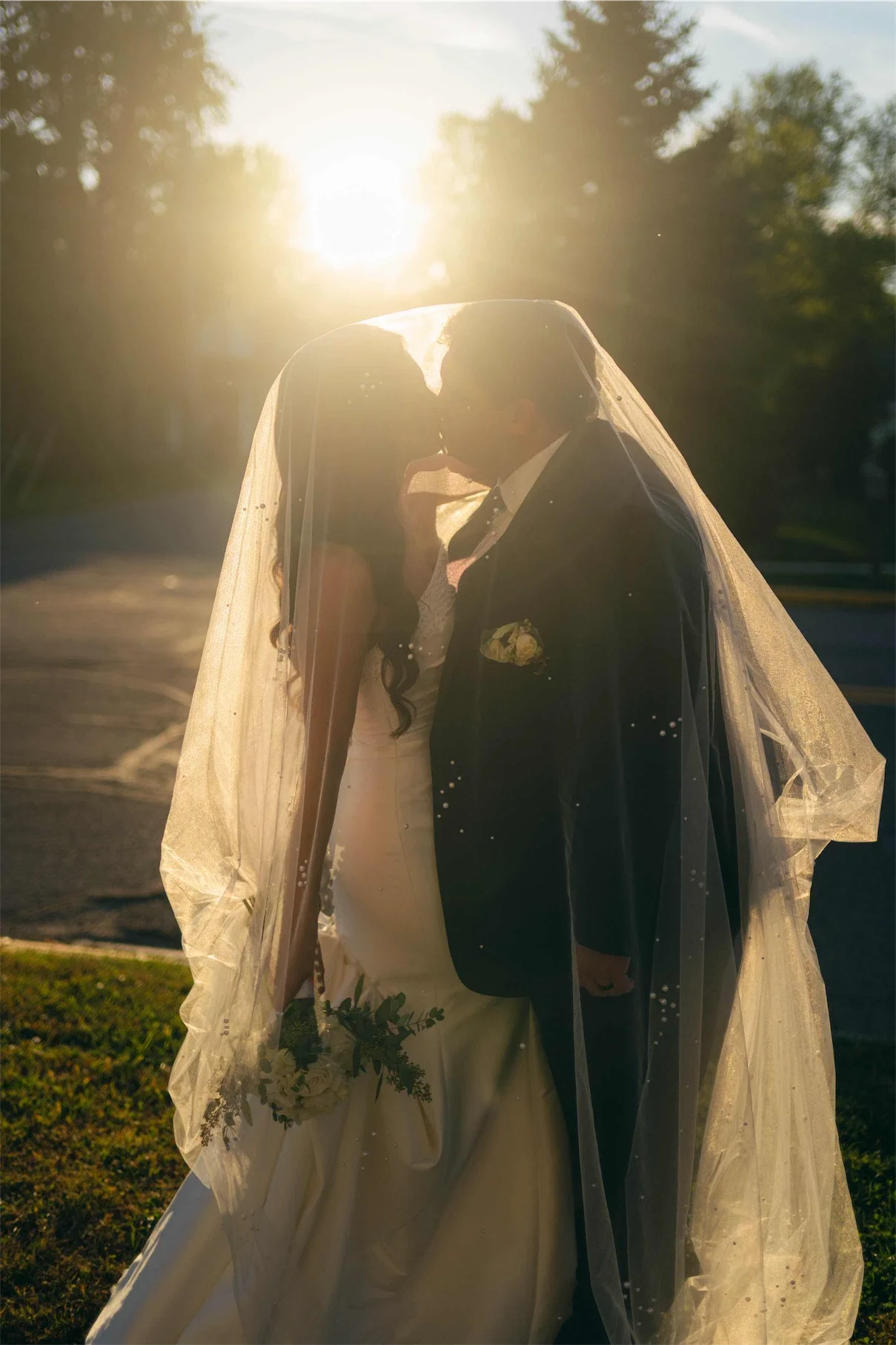 golden-hour-kiss-under-veil-sun-flare.webp