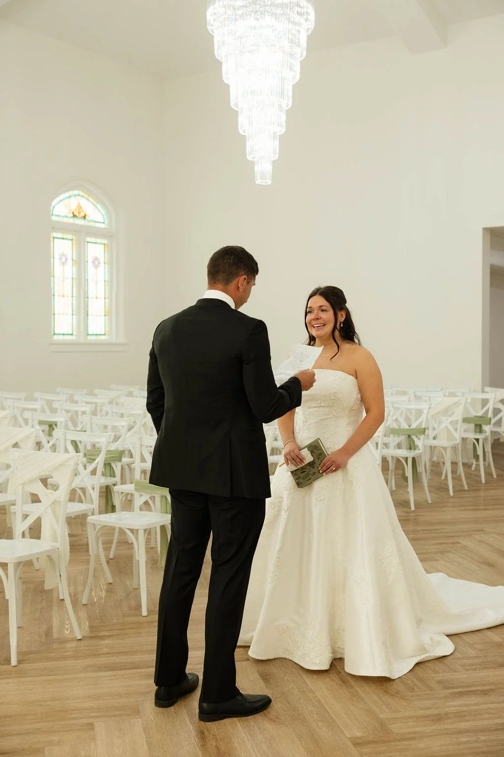 bride-and-groom-reading-vows-chapel.jpg