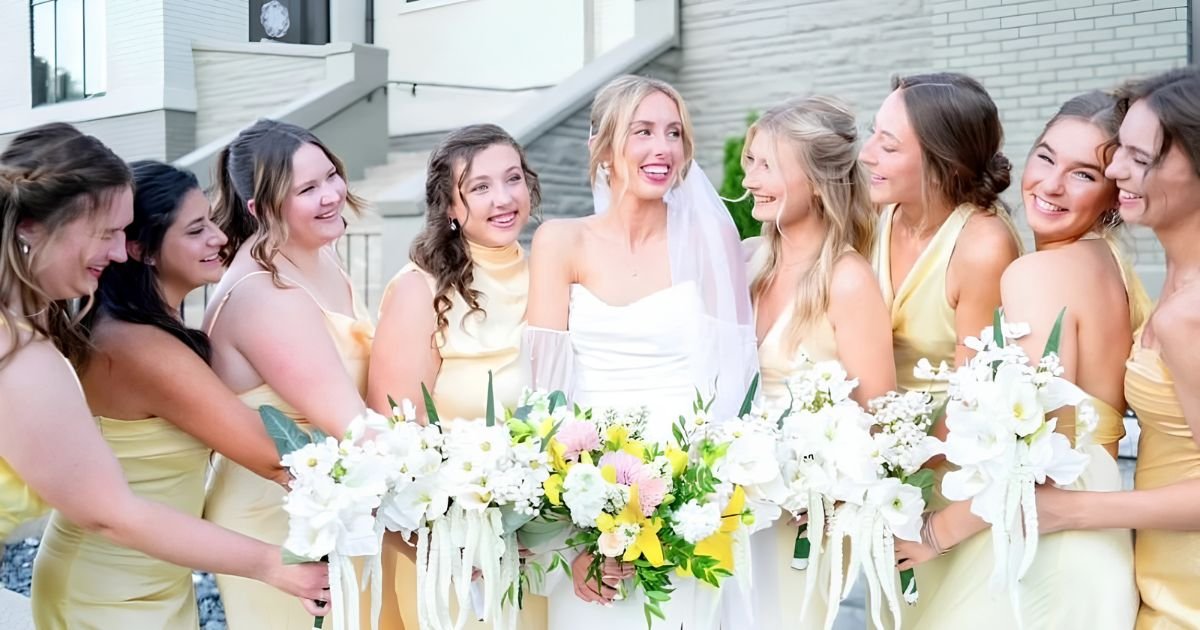 Bride and bridesmaids in yellow dresses pose with bouquets outside Kaleidoscope Weddings venue in summer