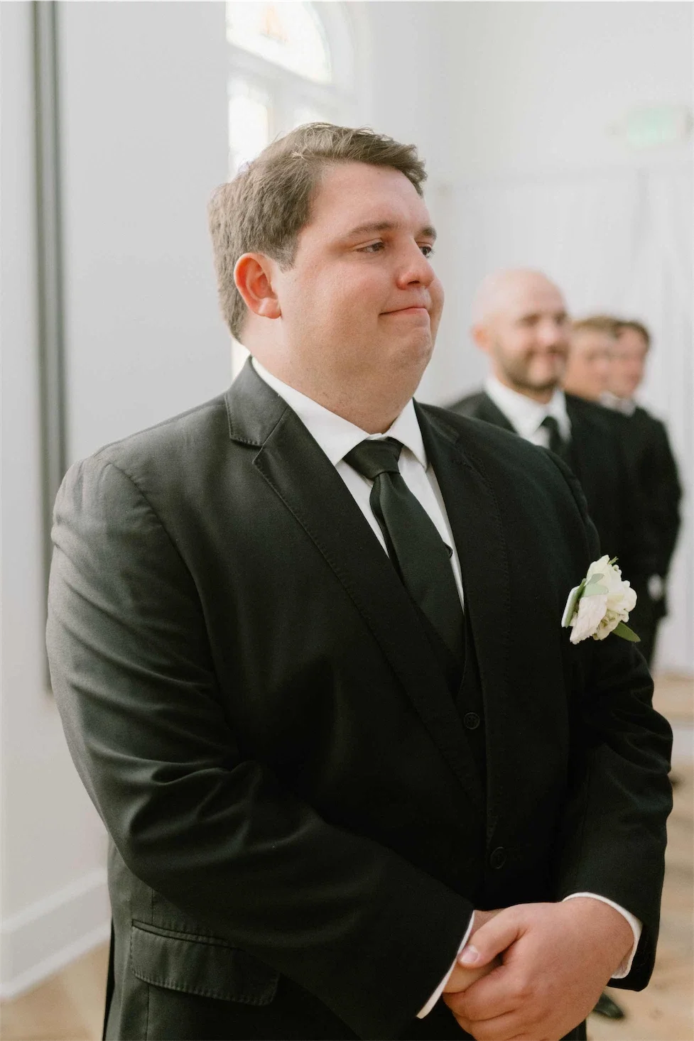 groom-emotional-at-altar-watching-bride.webp
